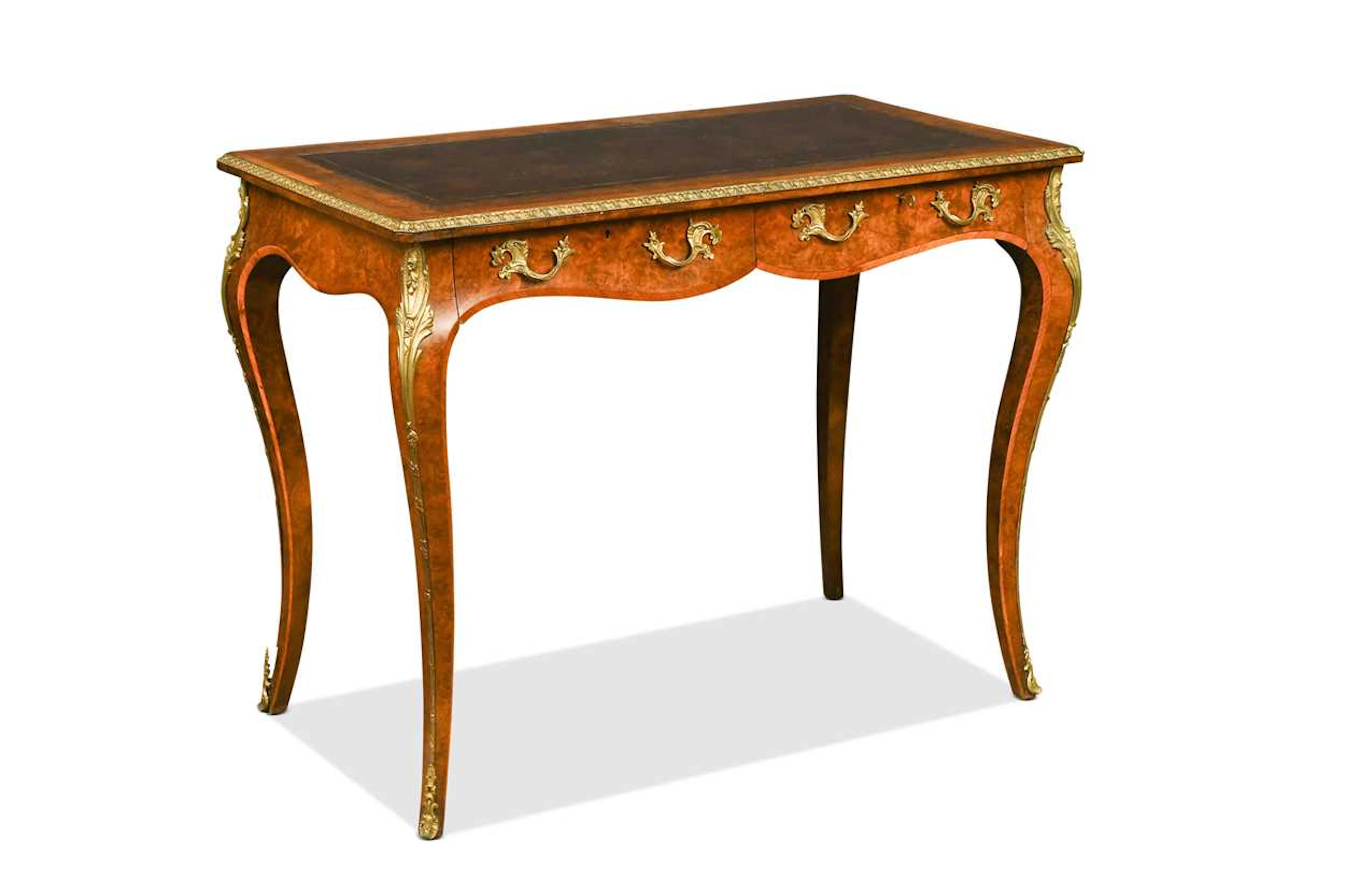 A Howard & Sons walnut and gilt metal mounted writing table, late 19th century