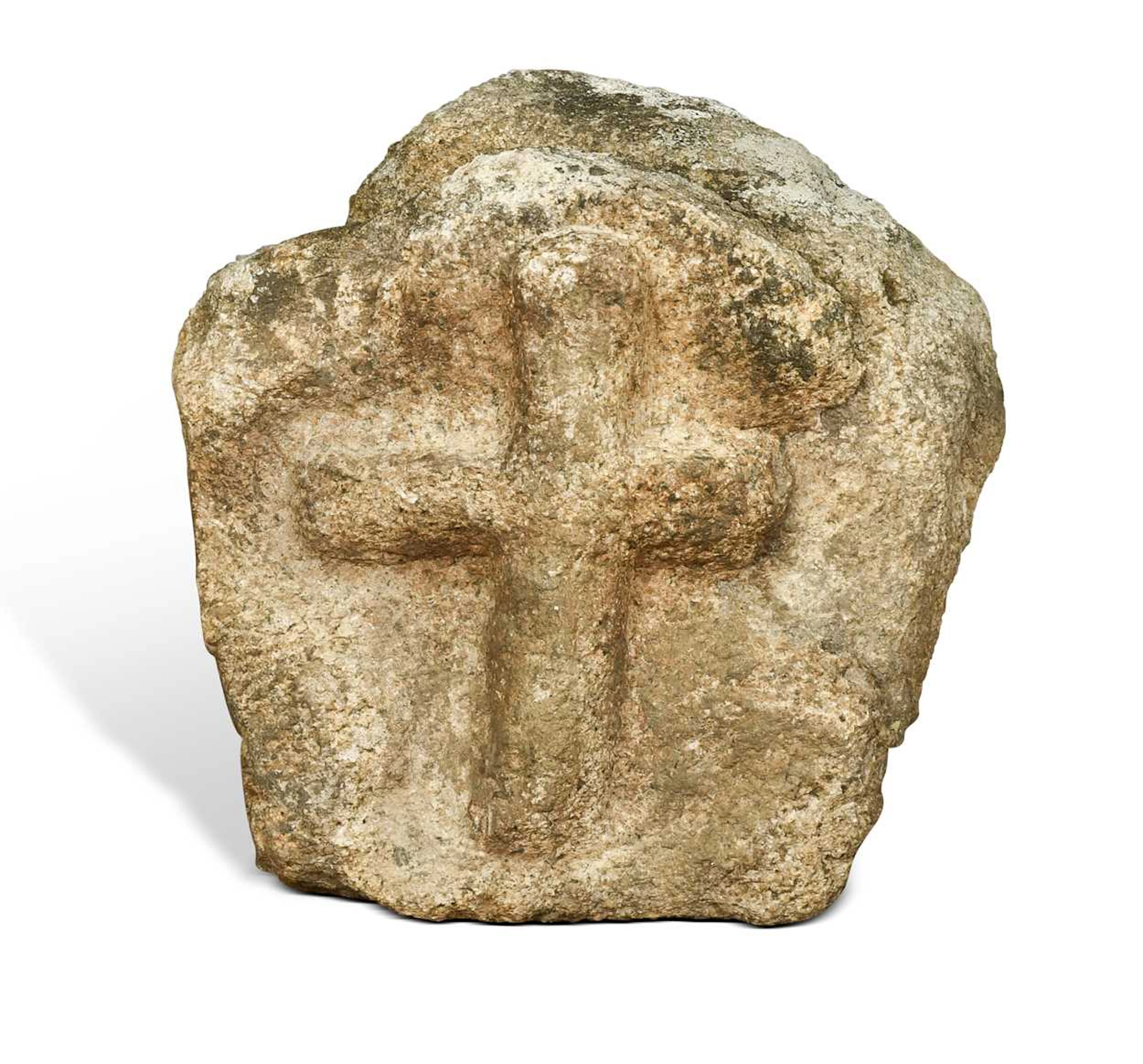 A carved stone depicting a crucifix in relief