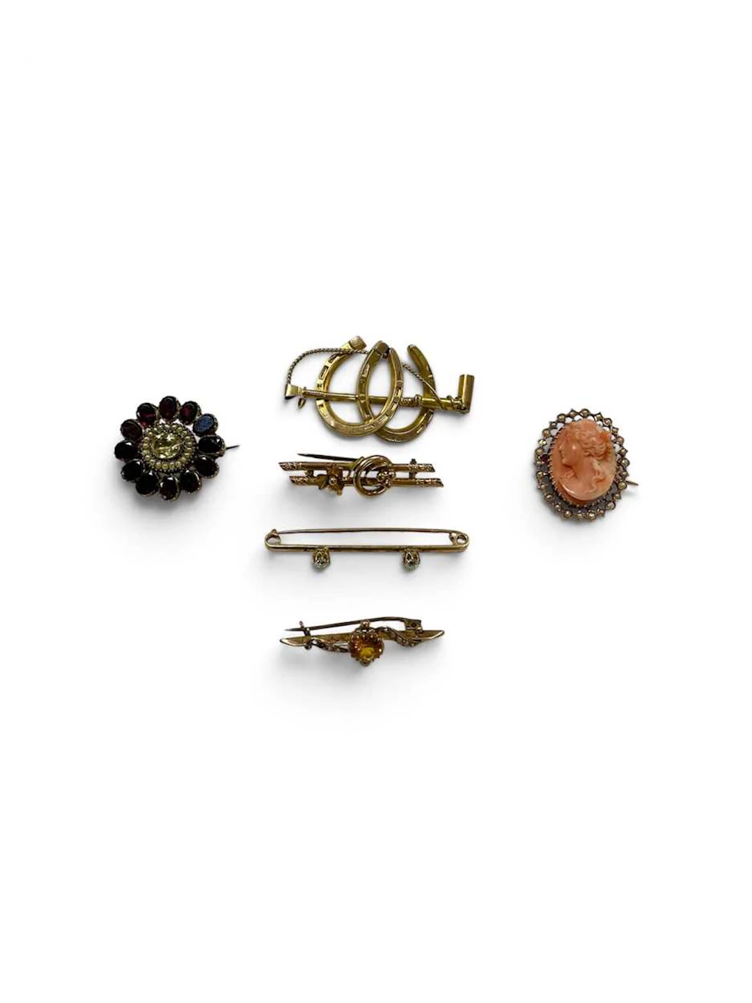 A collection of brooches