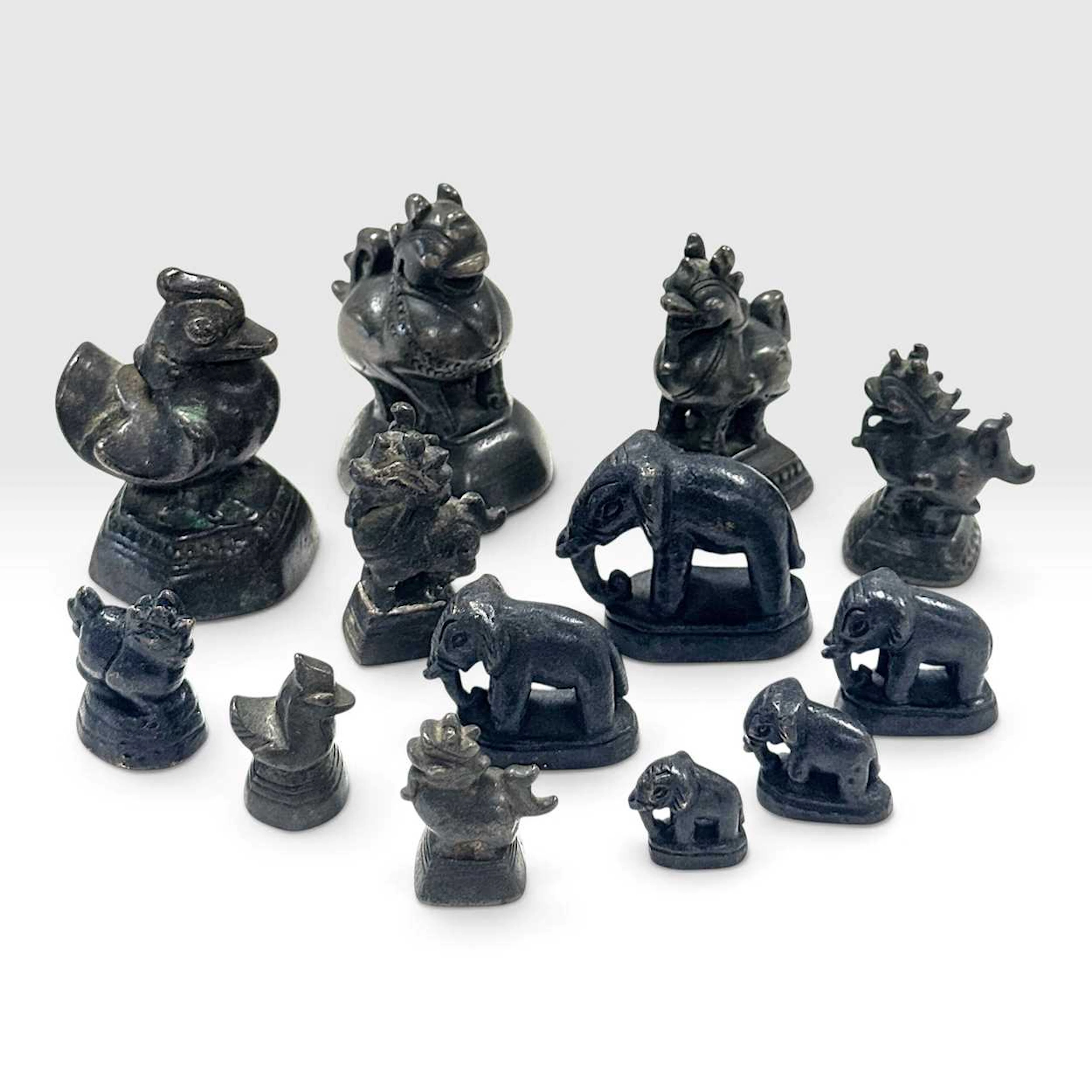 A group of thirteen opium weights, 19th century