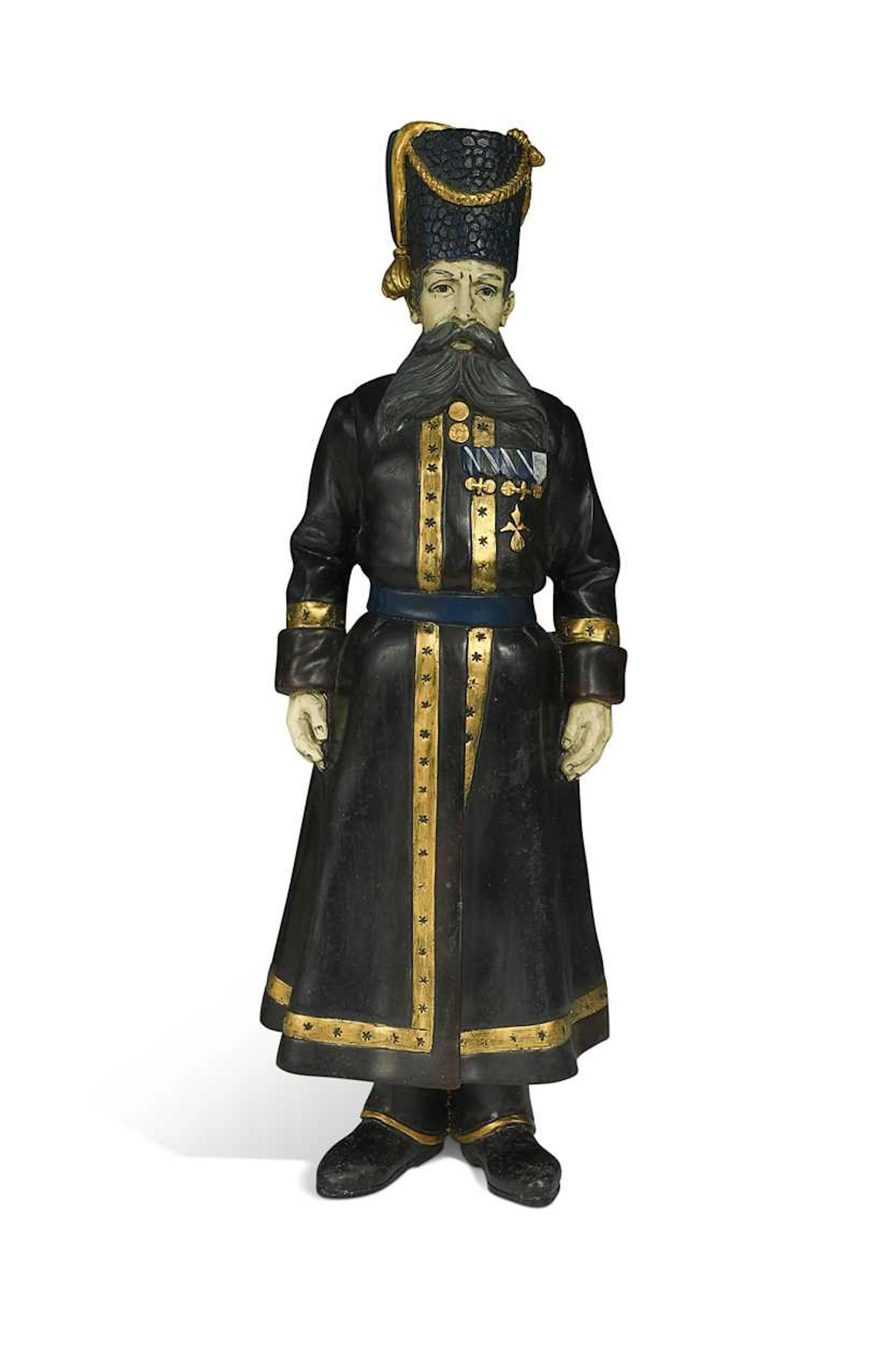 In the manner of Faberge, a Russian cold-painted bronze model of a