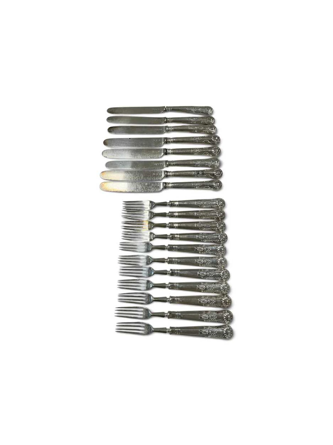 Eleven fruit forks and eight knives
