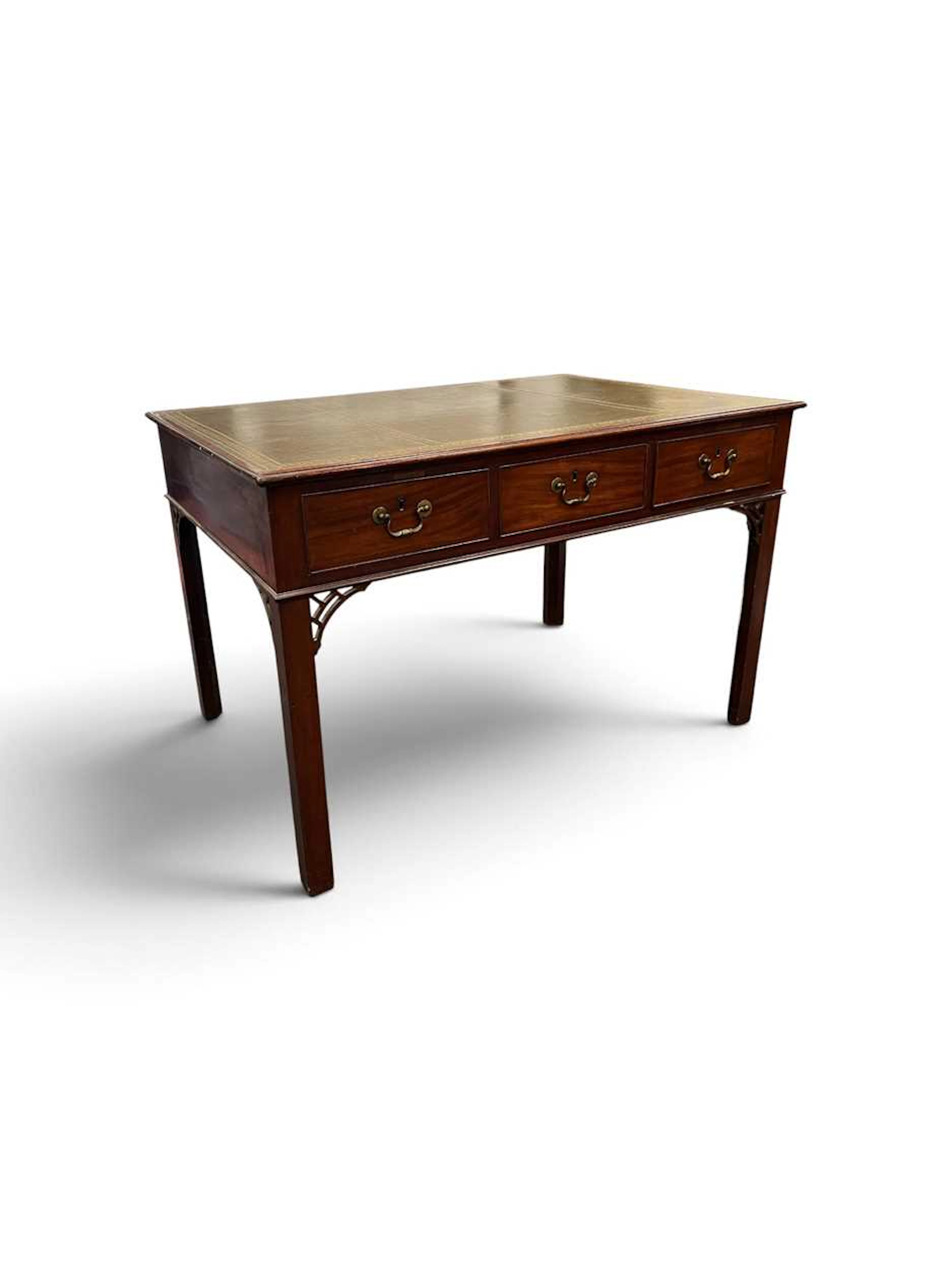 A George III style mahogany and leather topped library table