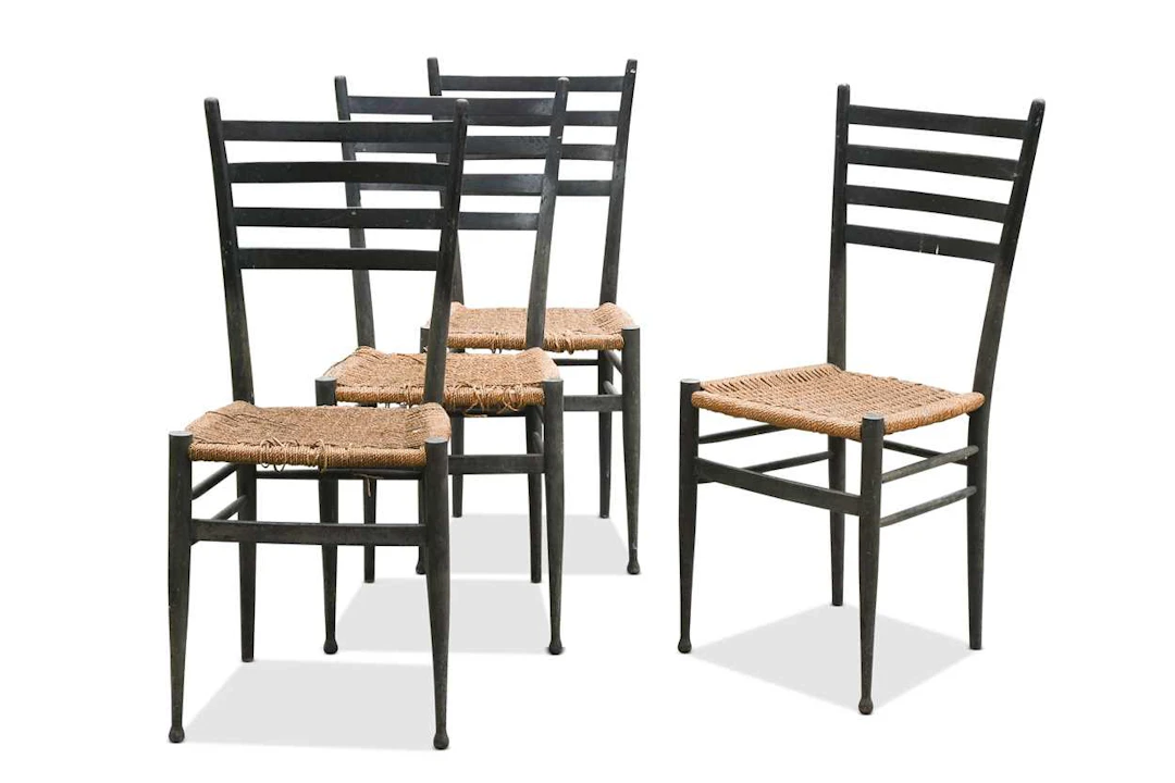 In the manner of Gio Ponti, a set of four mid-century Italian dining chairs