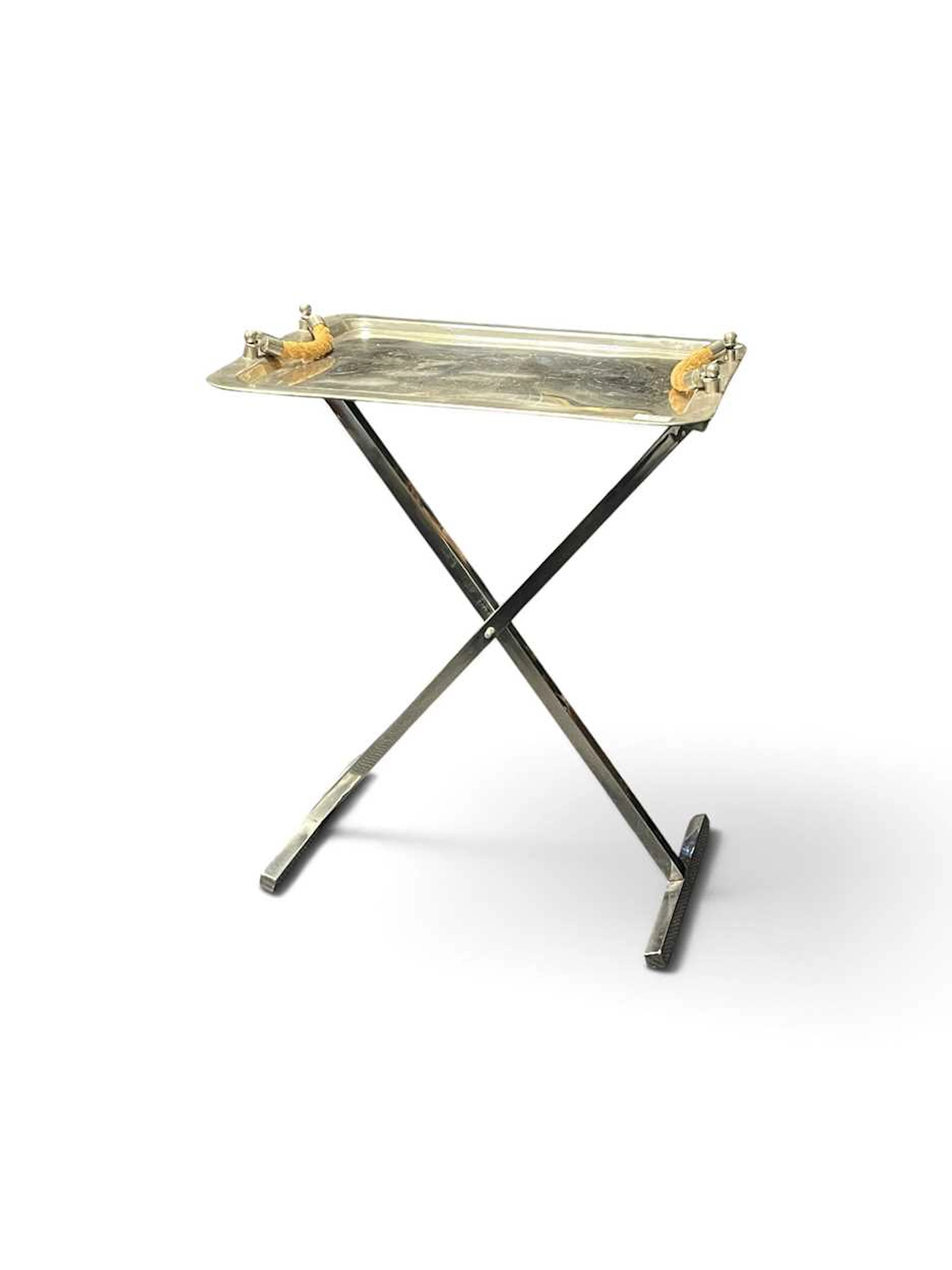 A nickel plated drinks tray on folding x-frame stand