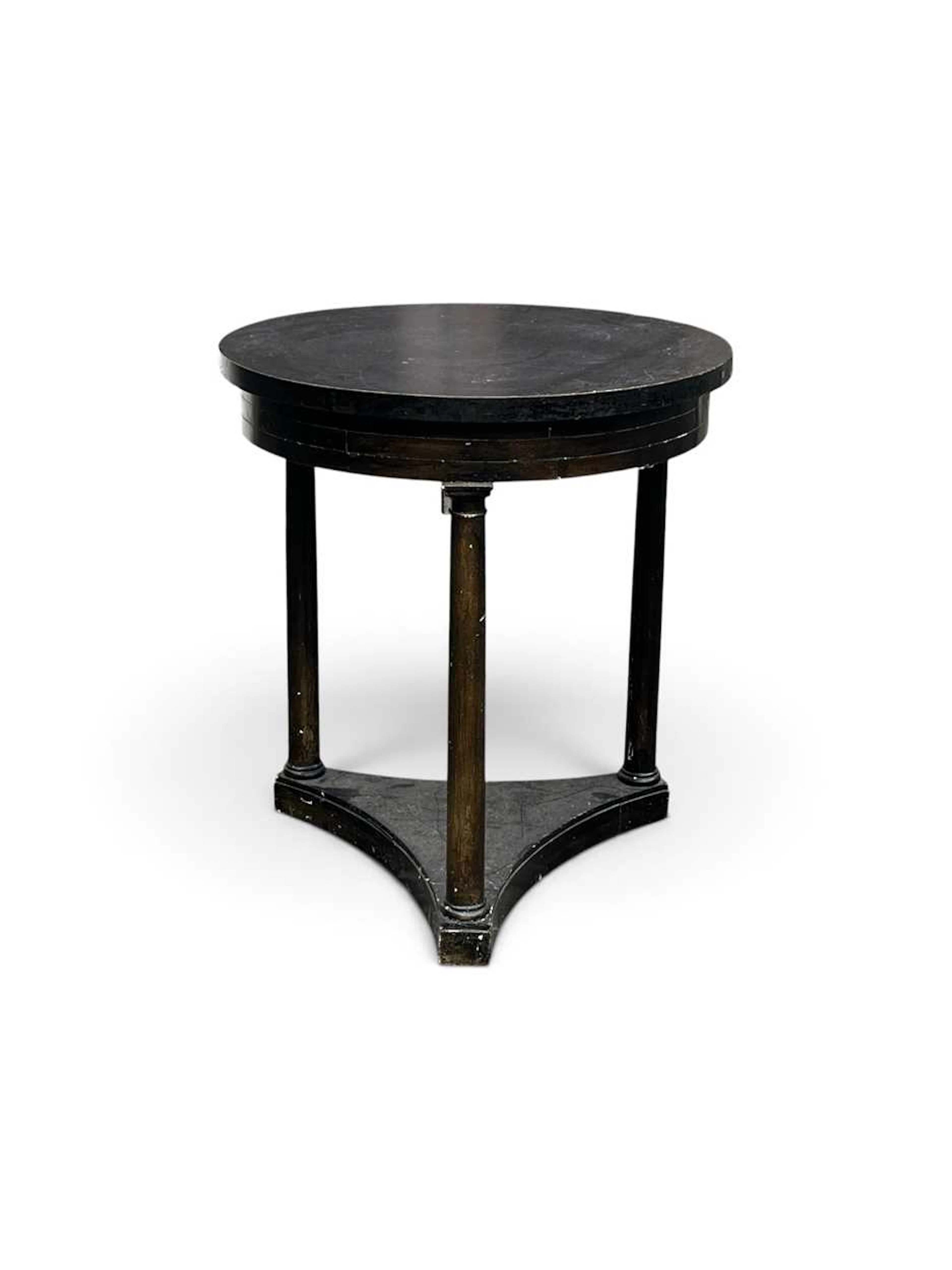 A French Empire style black painted guéridon