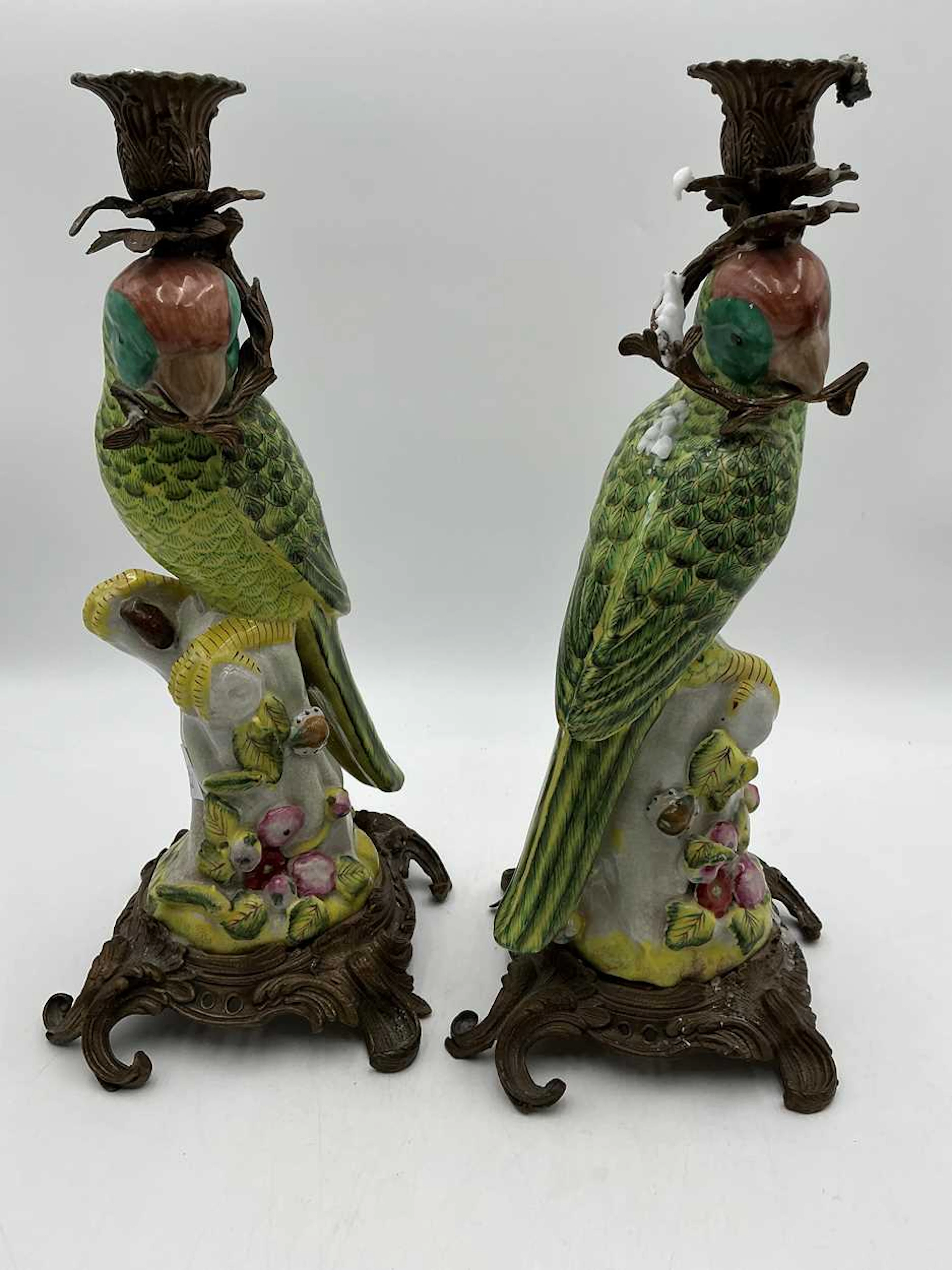 Pair of ormolu mounted ceramic candle holders in the form...