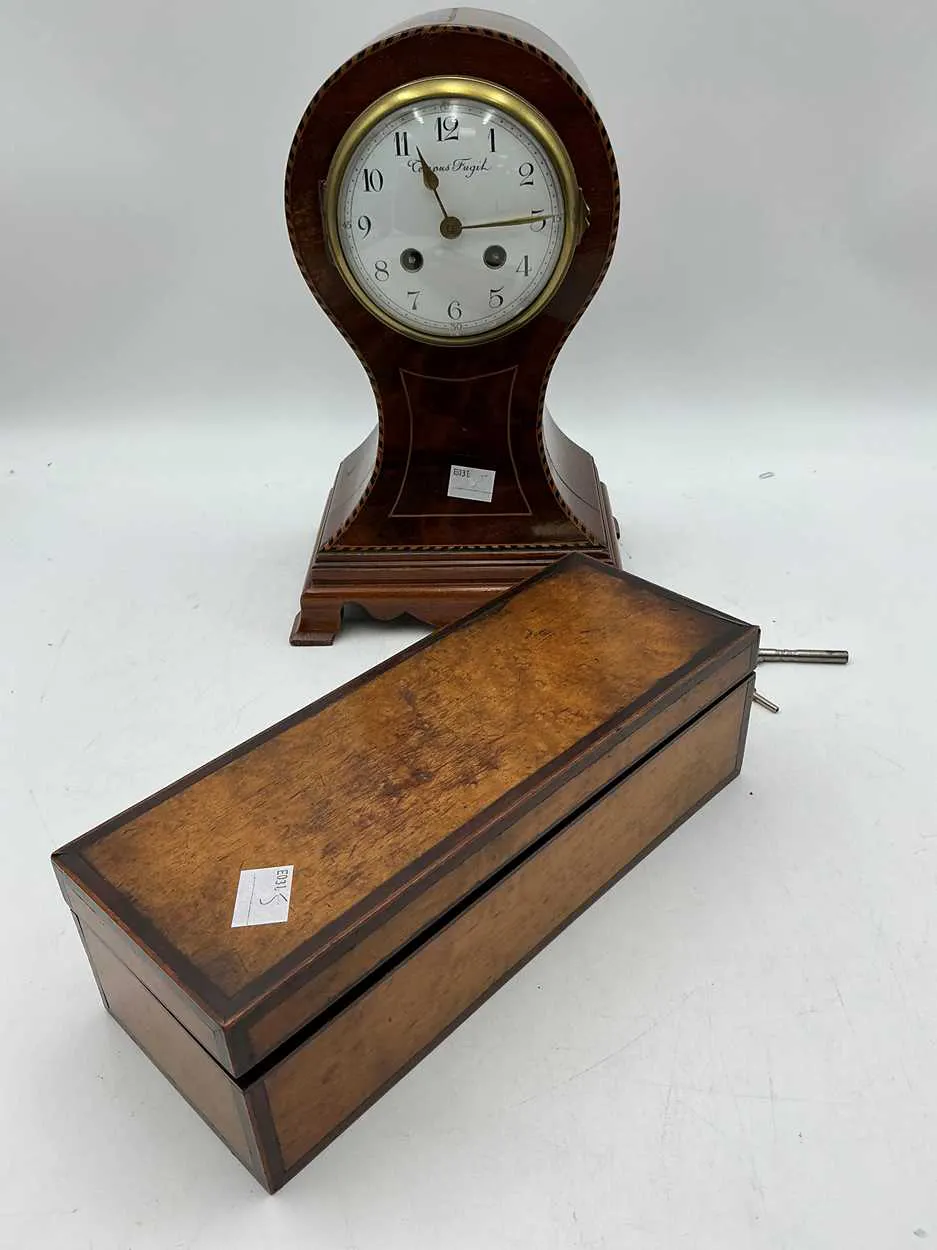 An Edwardian mahogany mantel clock of balloon shape case 28.5cm