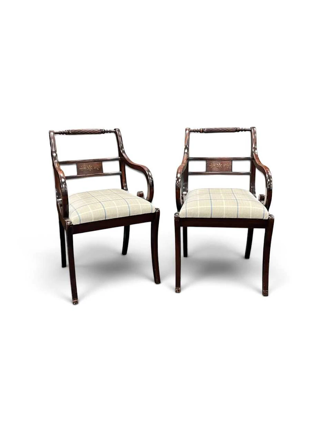 A pair of Regency style mahogany armchairs