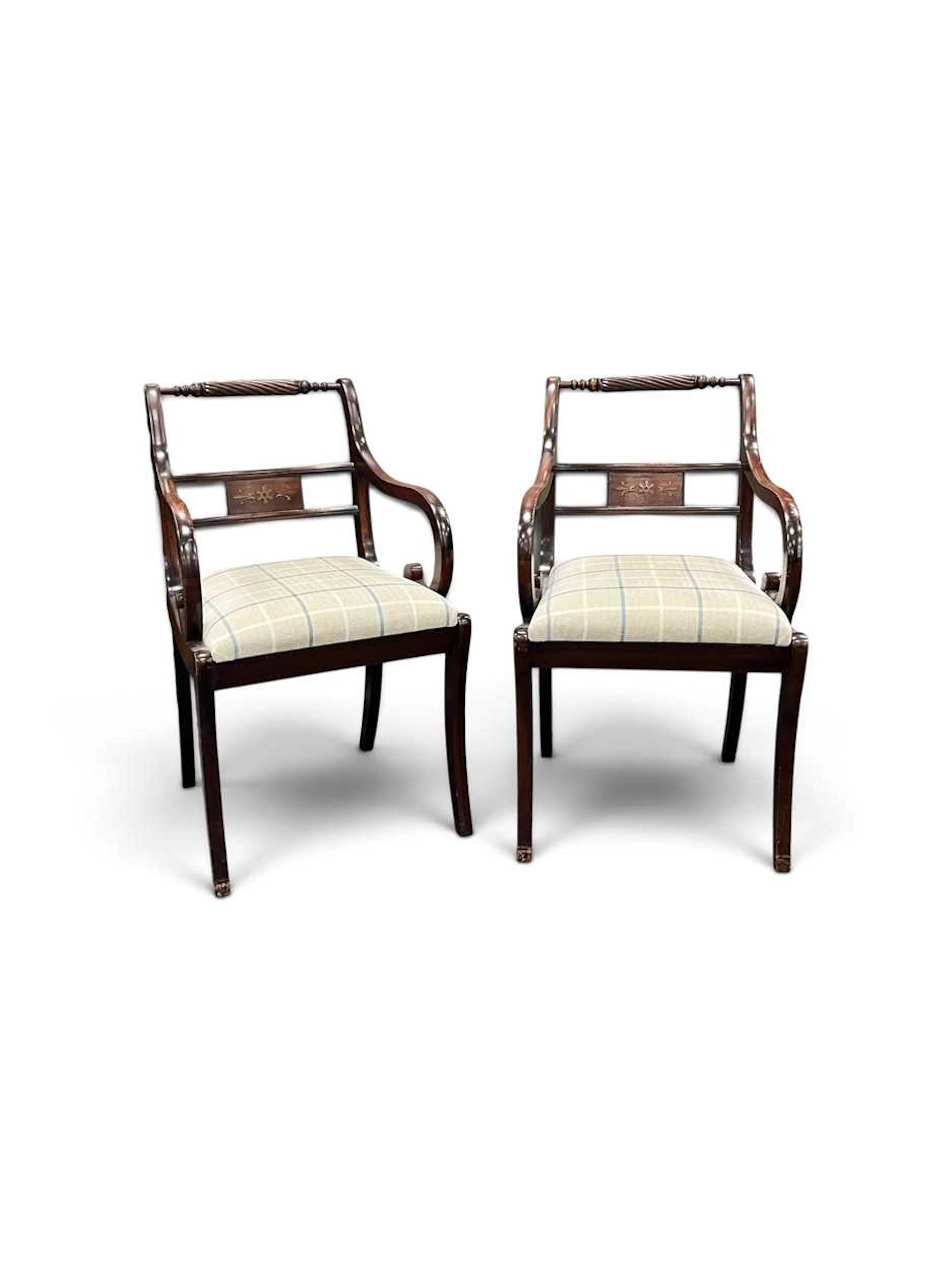 A pair of Regency style mahogany armchairs