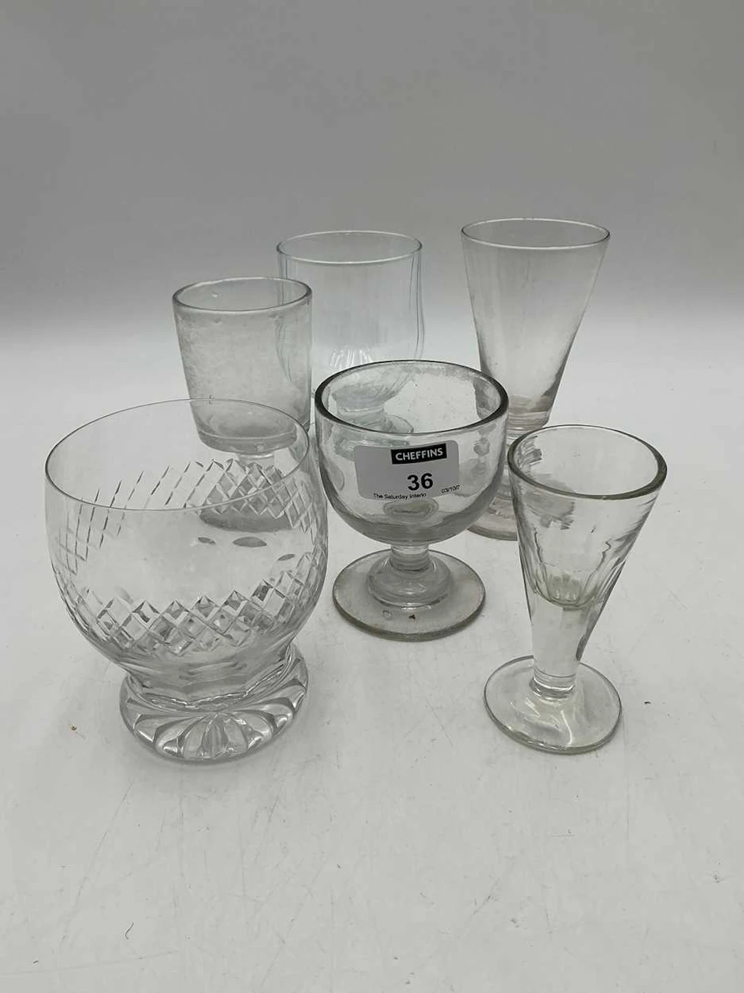 A large collection of tavern glasses together with a...