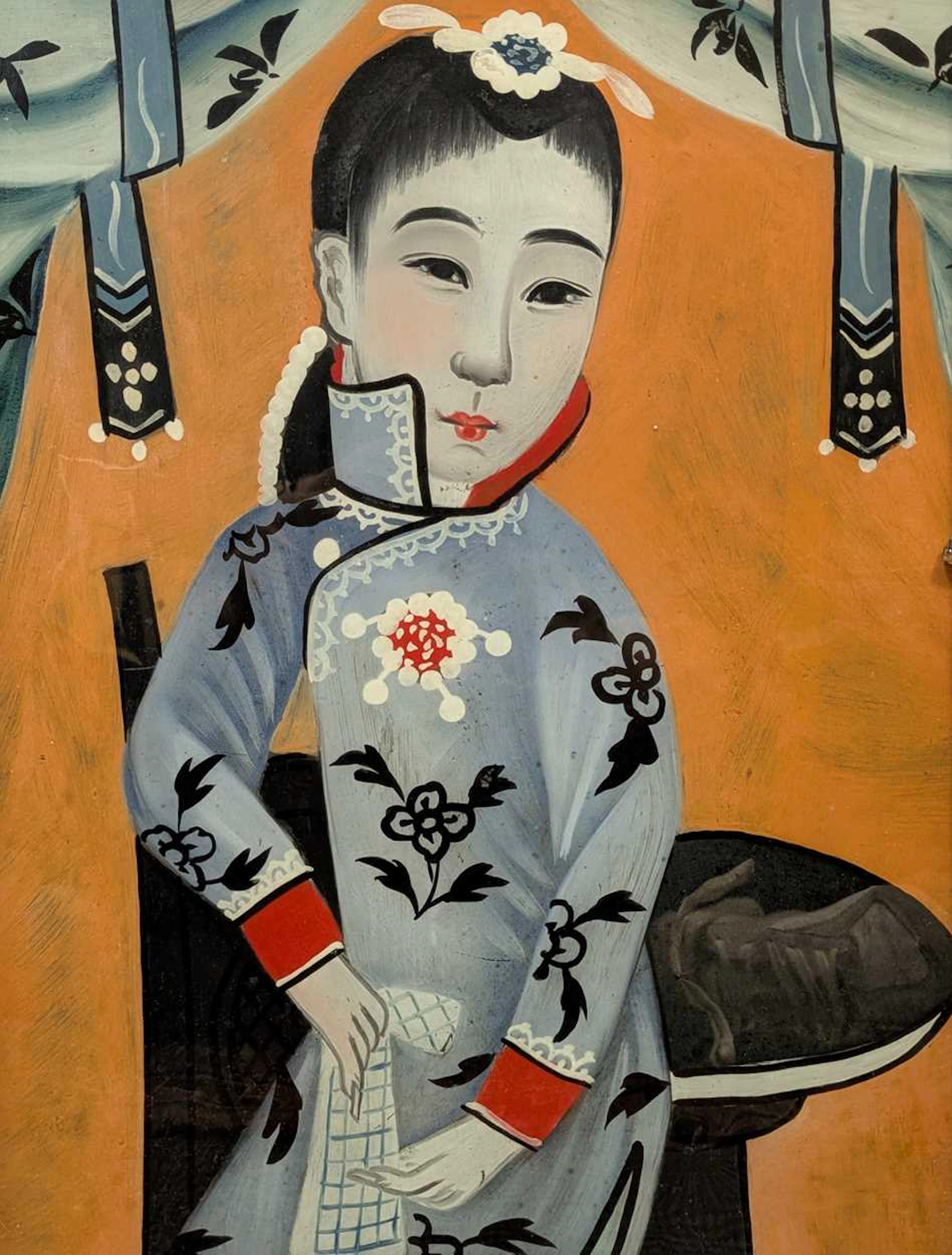 A 20th century Japanese reverse glass painting depicting a seated lady