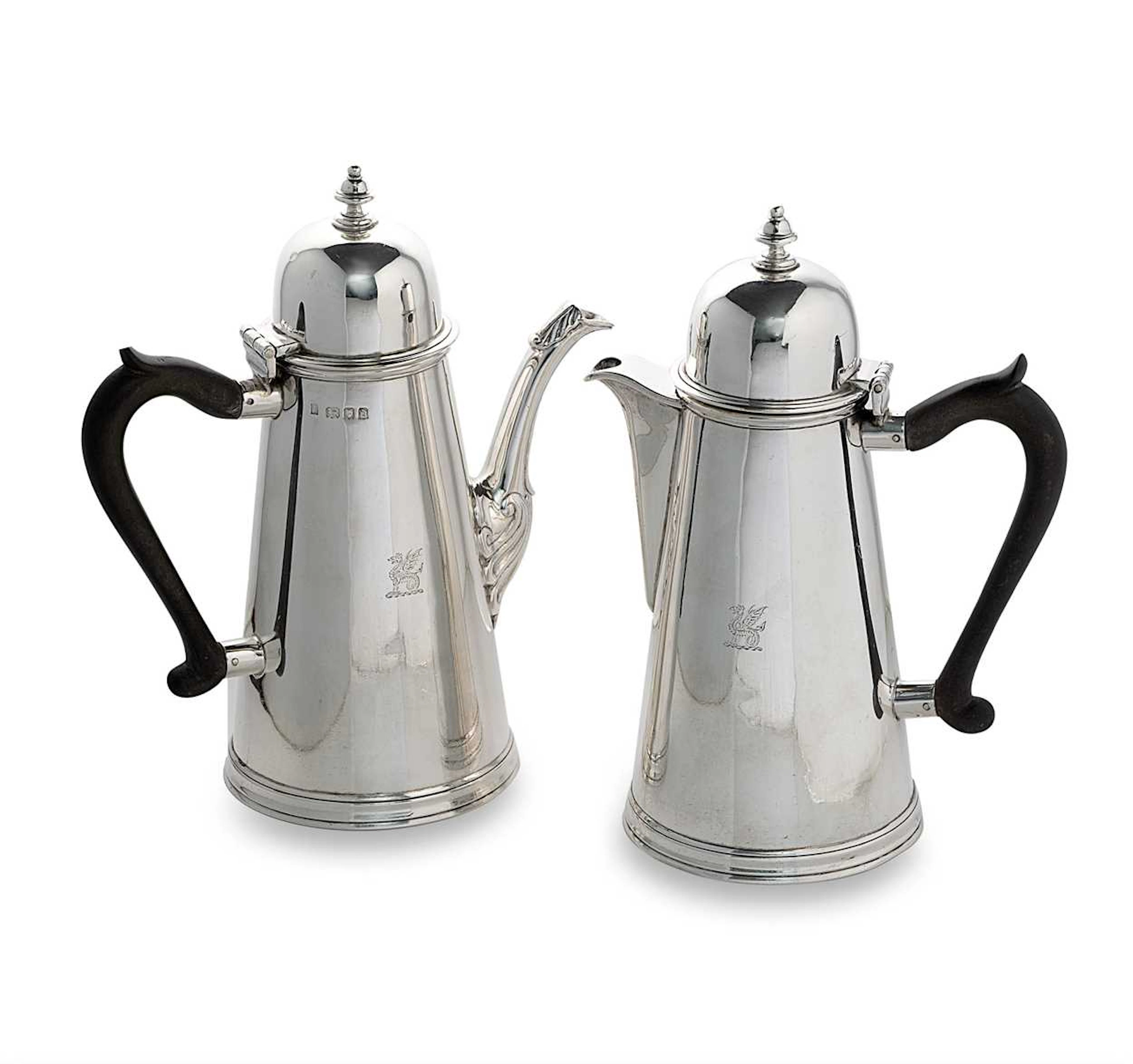 A George V silver coffee pot and matching hot water jug