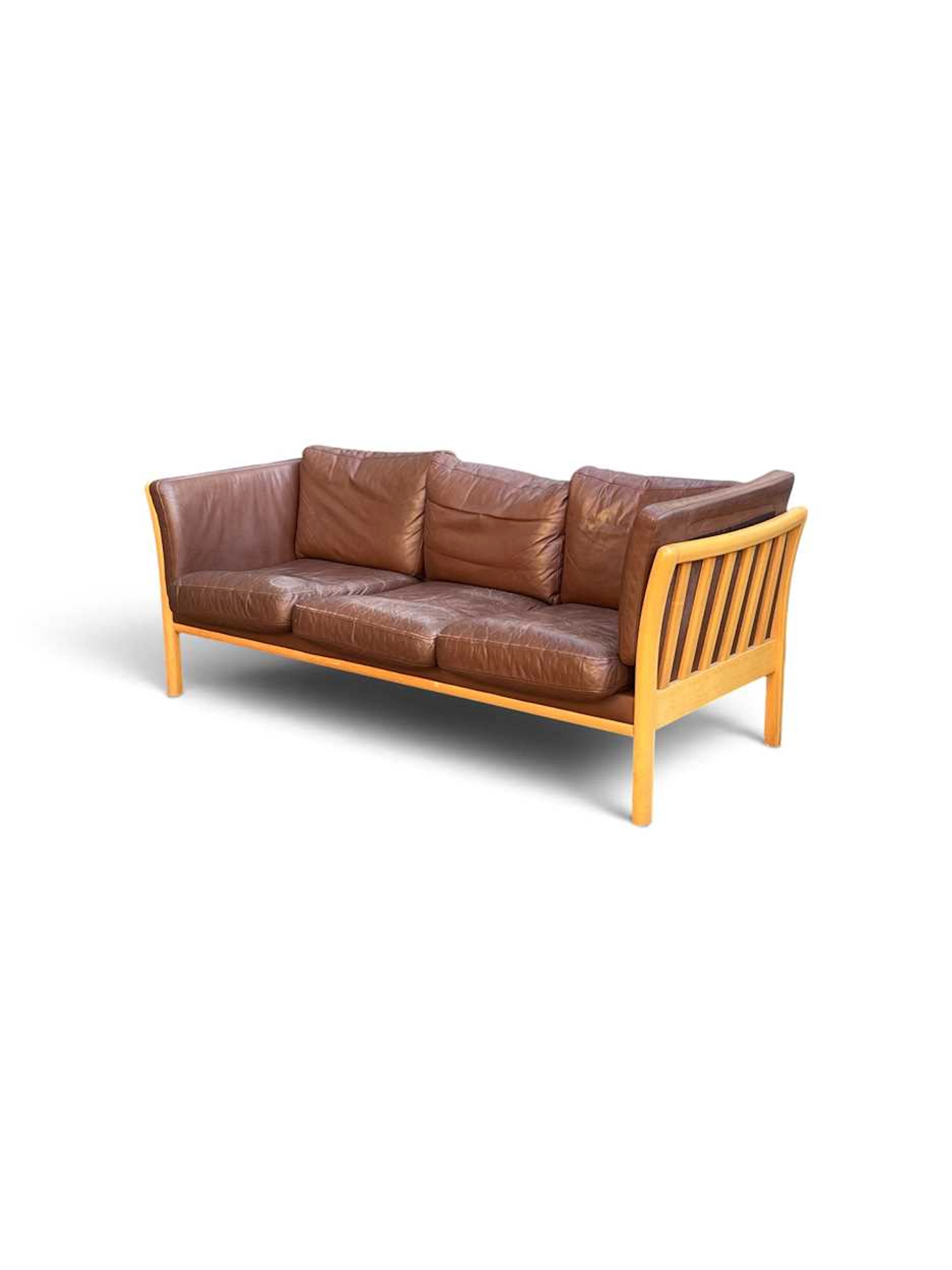 A Danish brown leather Stouby-type three seat sofa