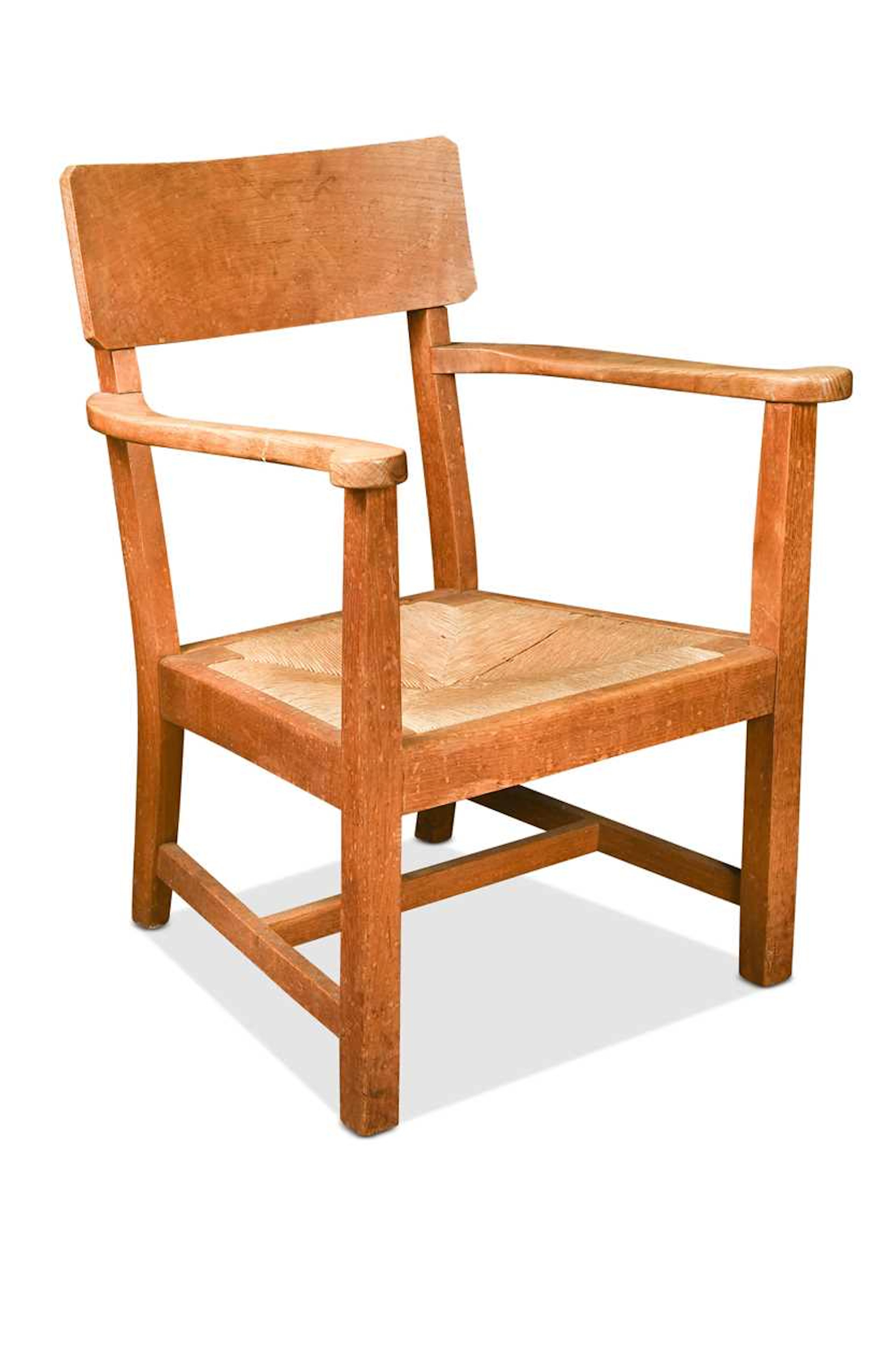 A Cotswold School oak low chair