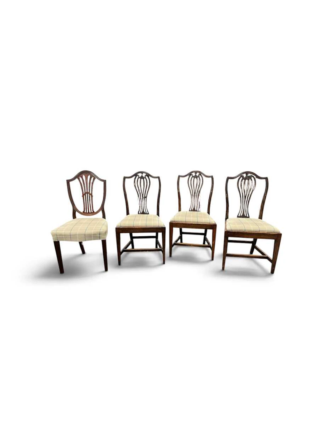 A set of three Hepplewhite style mahogany dining chairs