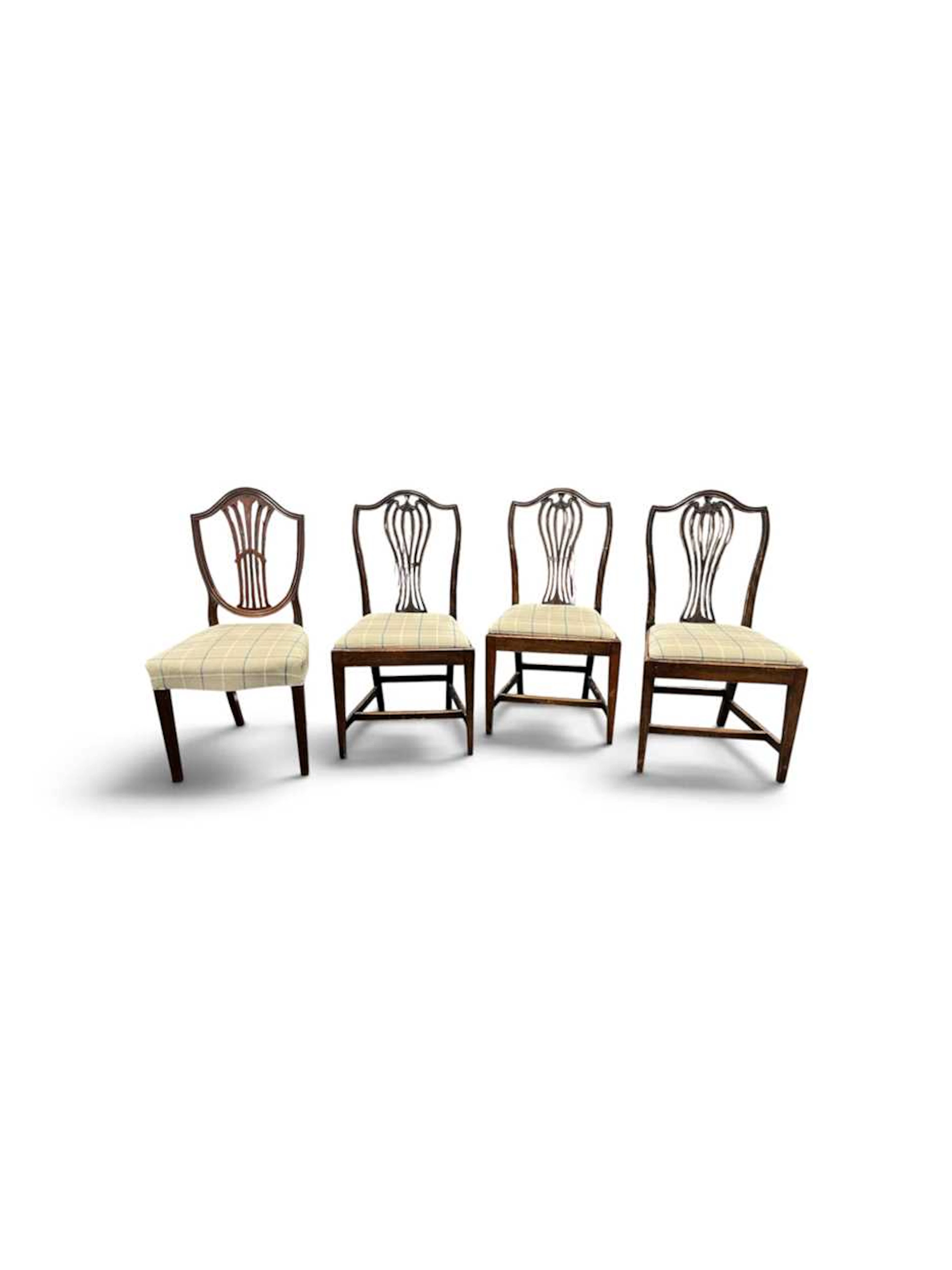 A set of three Hepplewhite style mahogany dining chairs