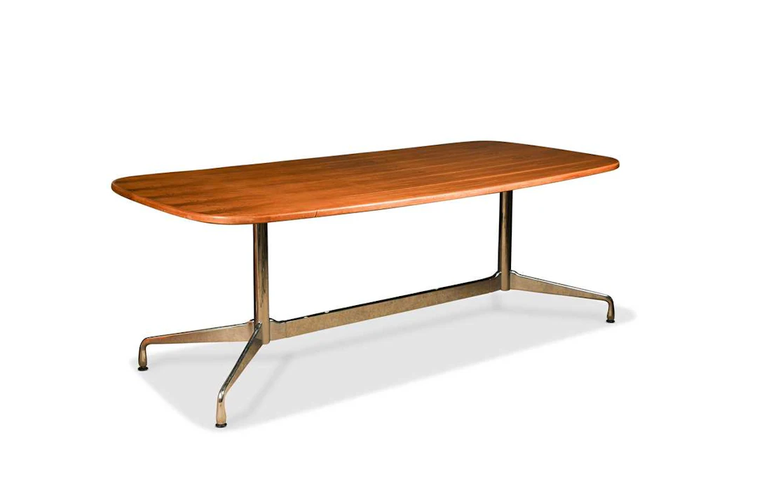 Charles and Ray Eames for Herman Miller, a rosewood and chrome dining table