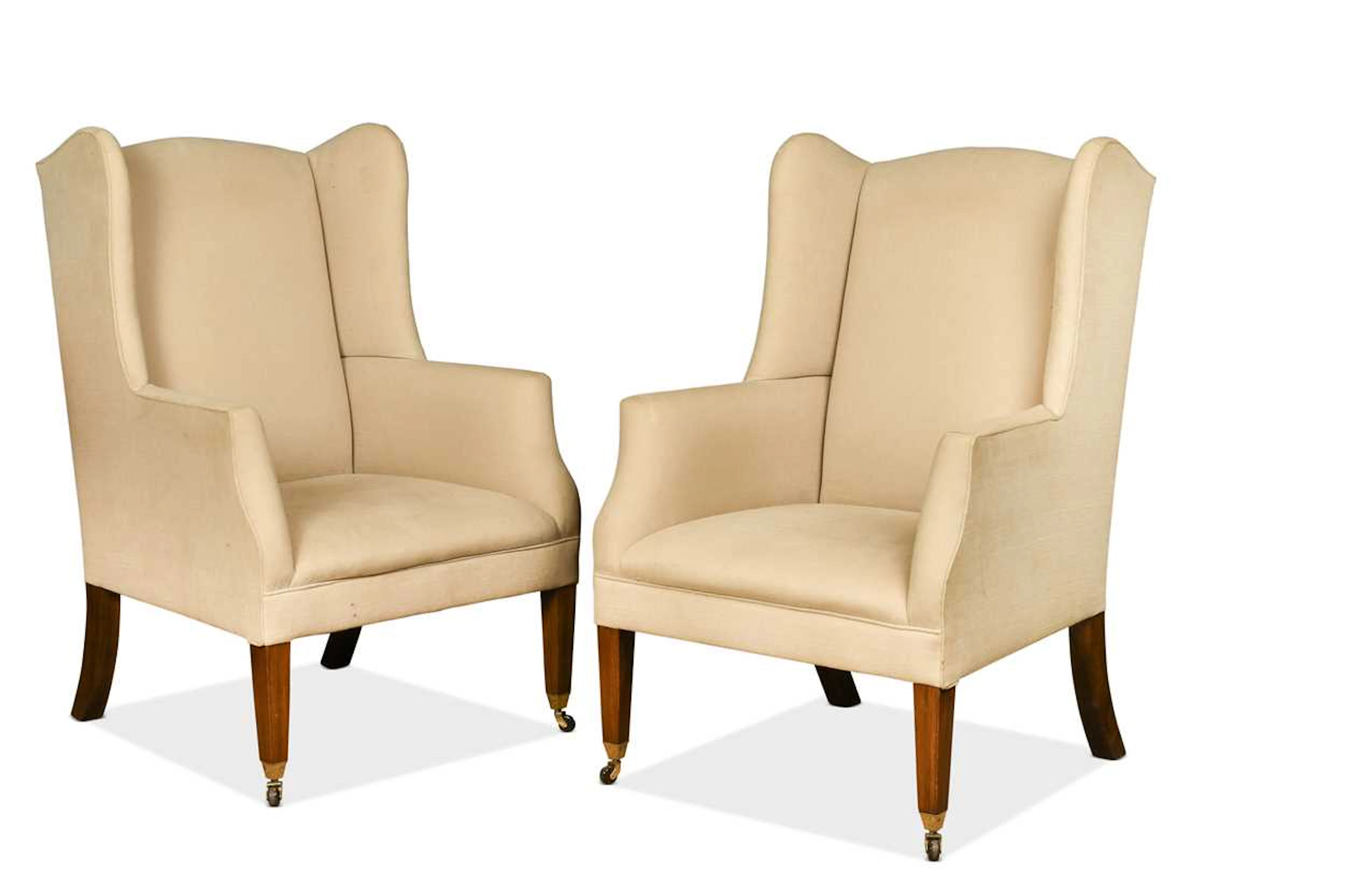 A pair of wingback armchairs by Balmain & Balmain