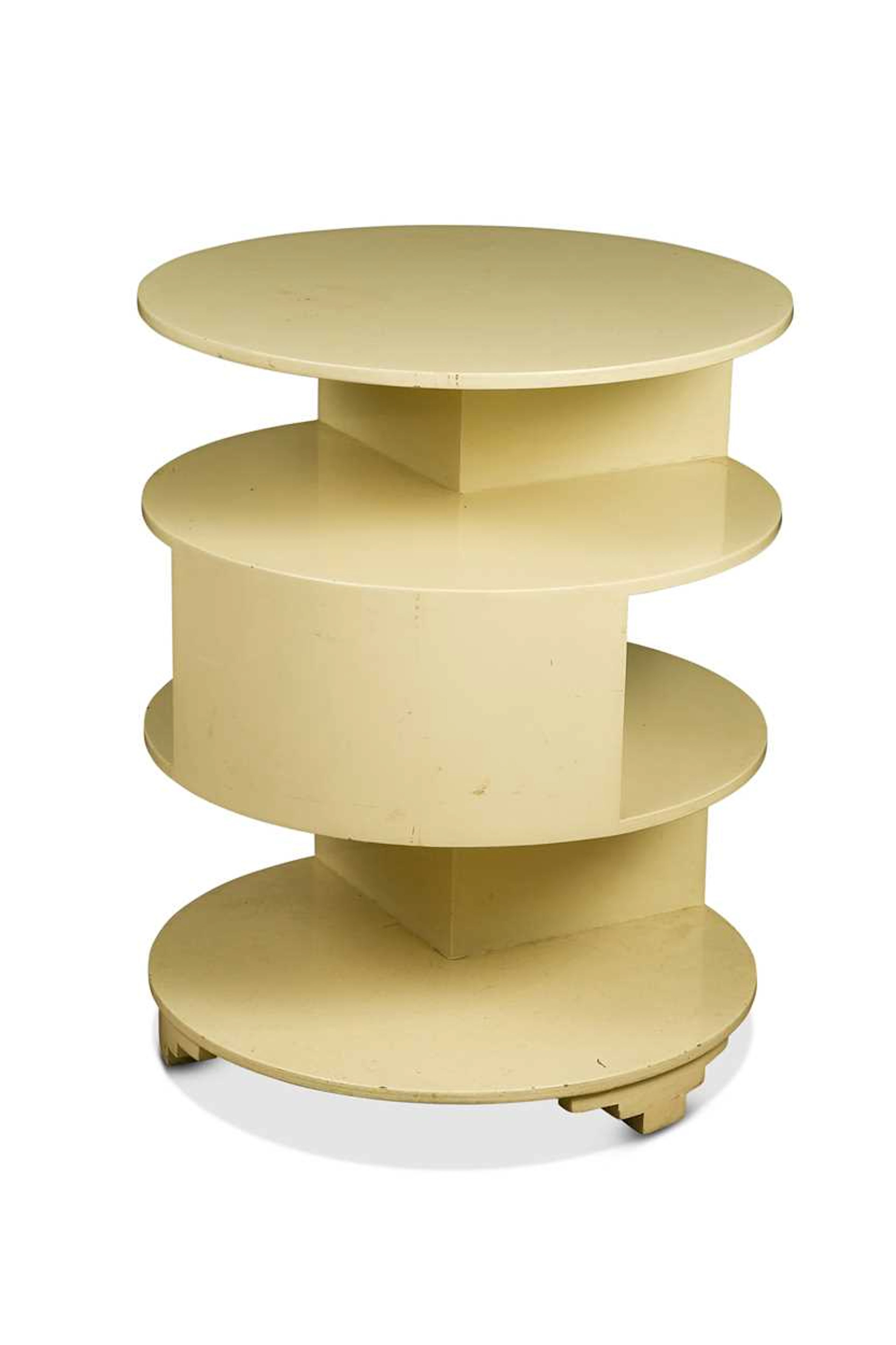 An Art Deco painted asymmetrical book table