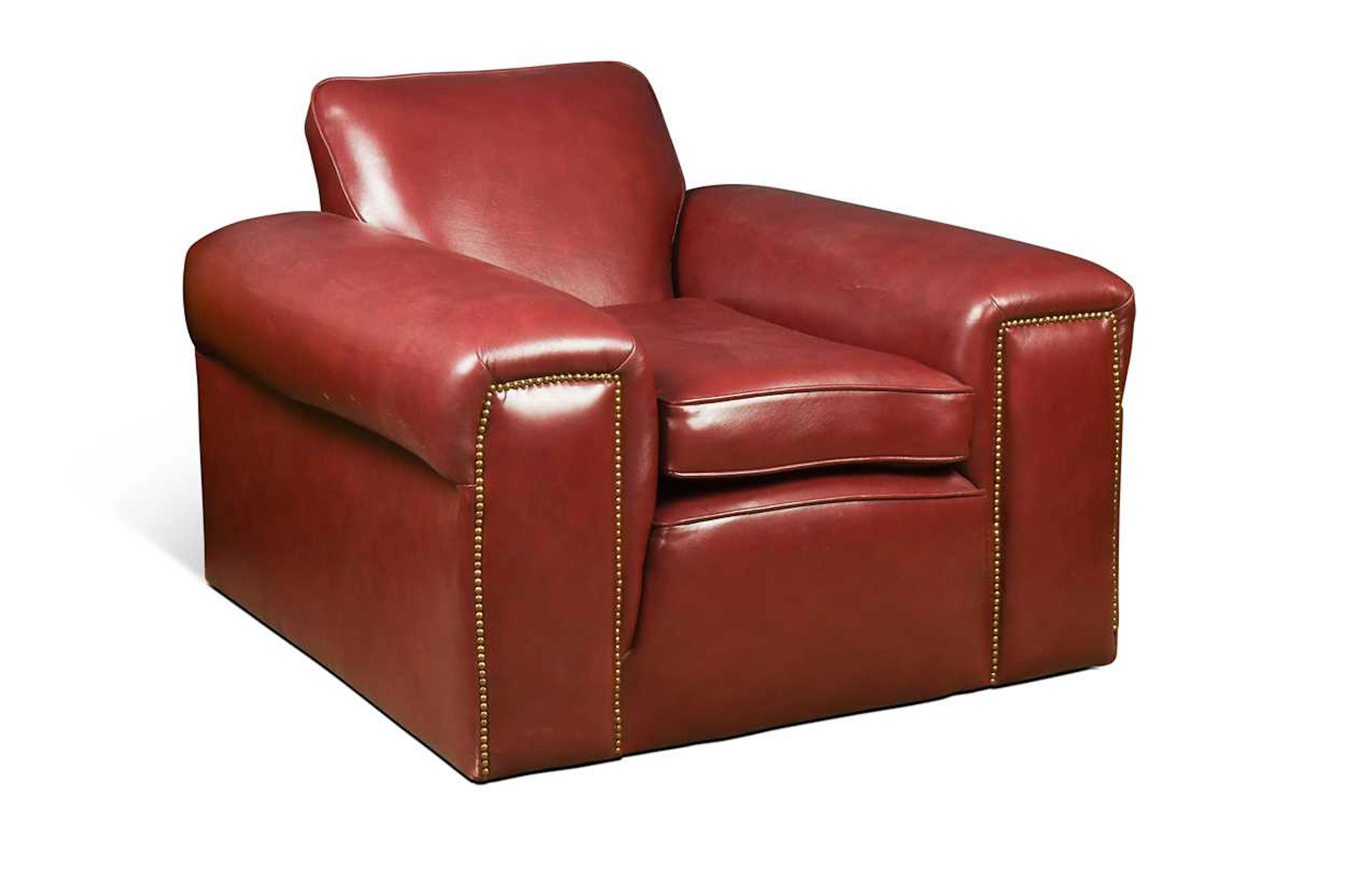 A generously proportioned bespoke cognac leather armchair
