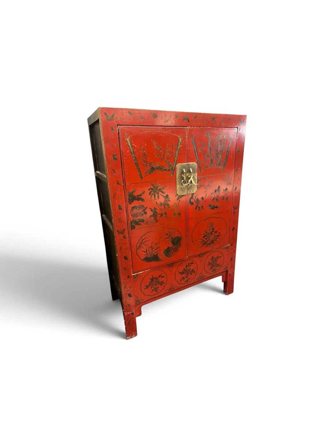 A Chinese red and gilt painted cupboard