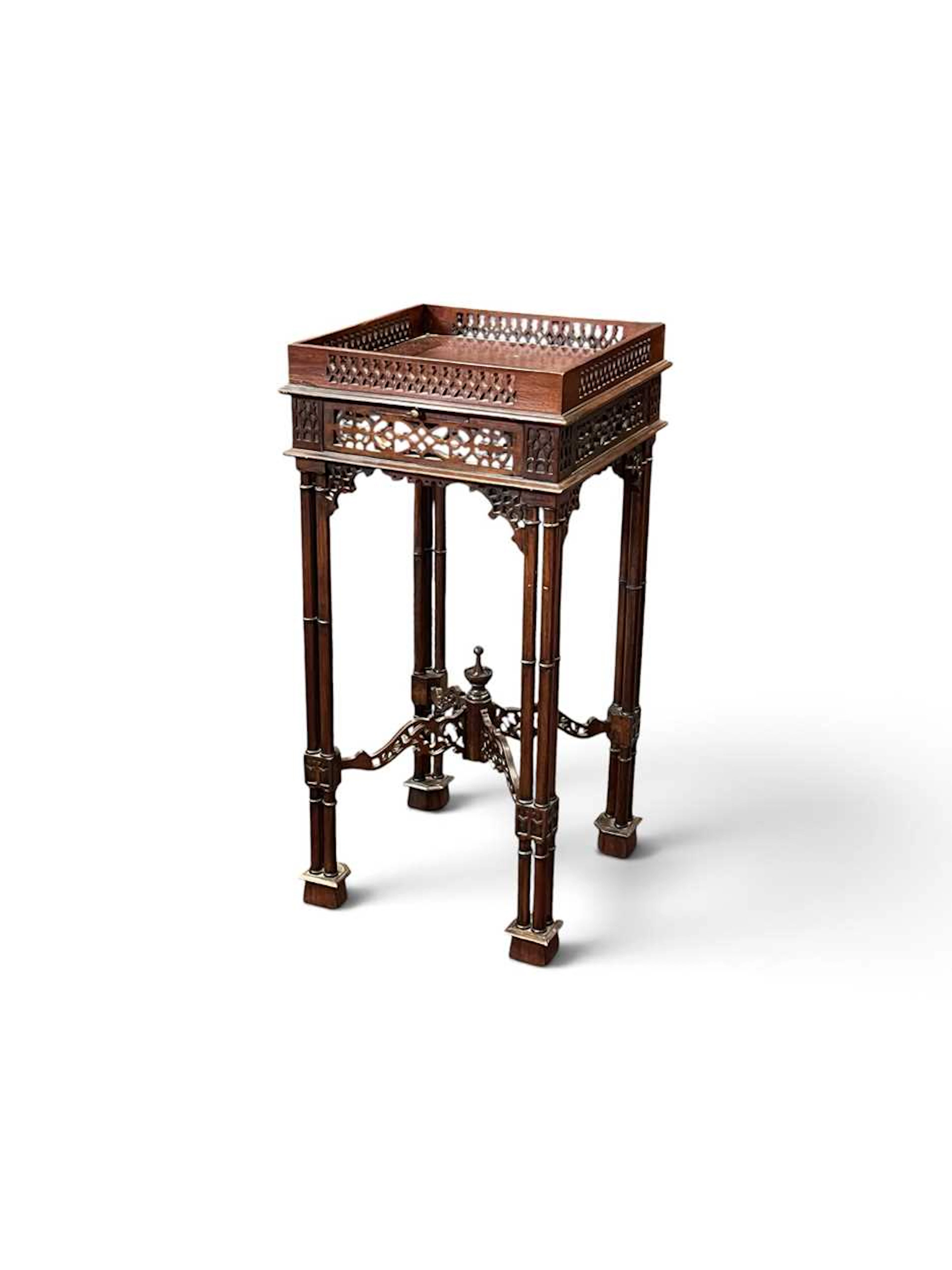 A Chippendale style mahogany urn stand