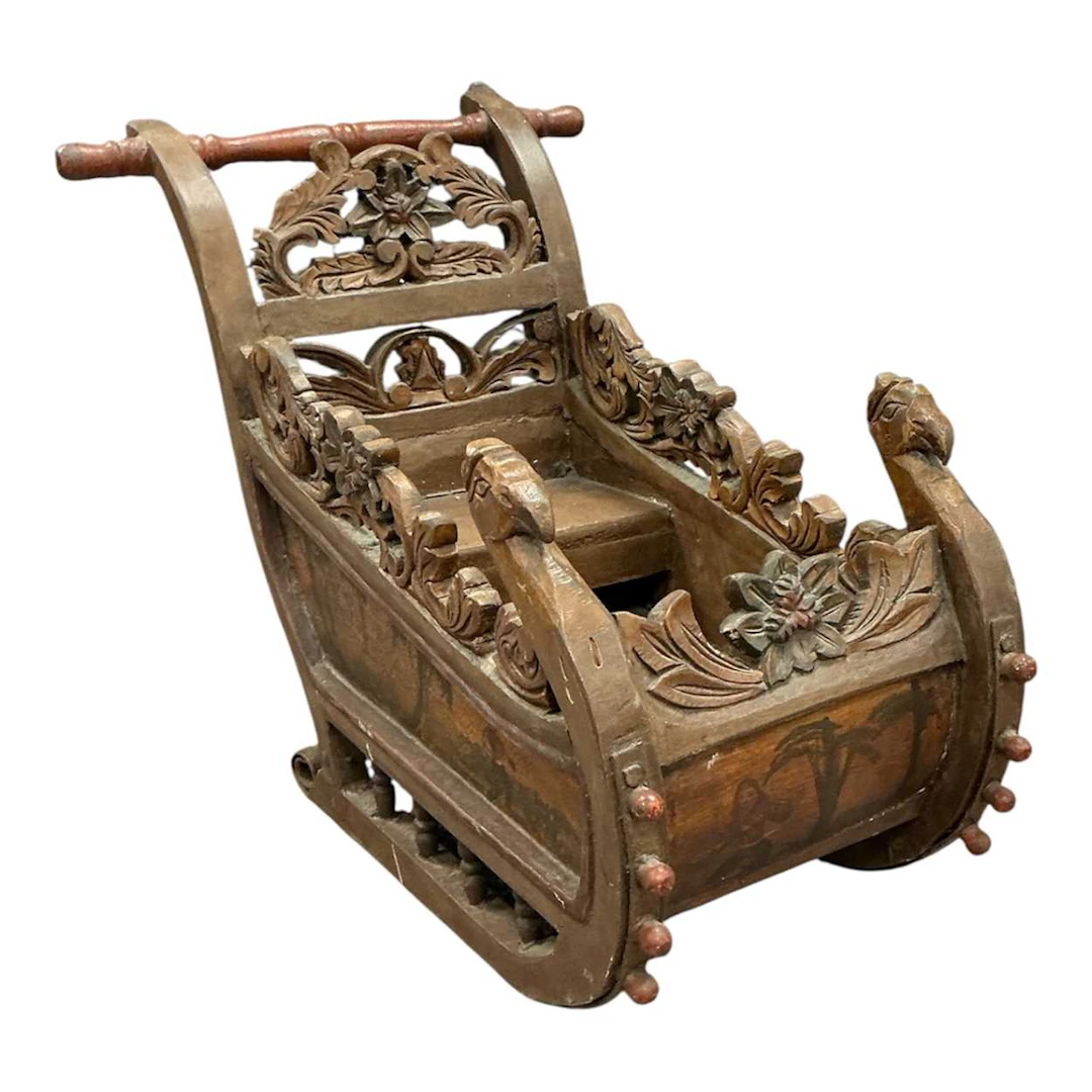 Carved and painted miniature sleigh with inset painted sections