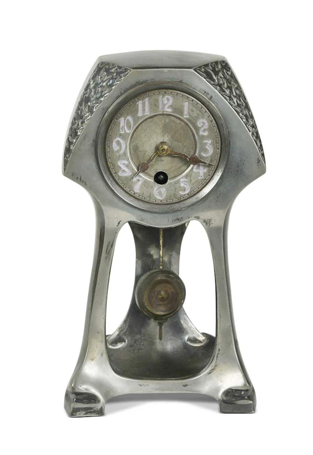 A Continental Art Nouveau pewter mantle clock
