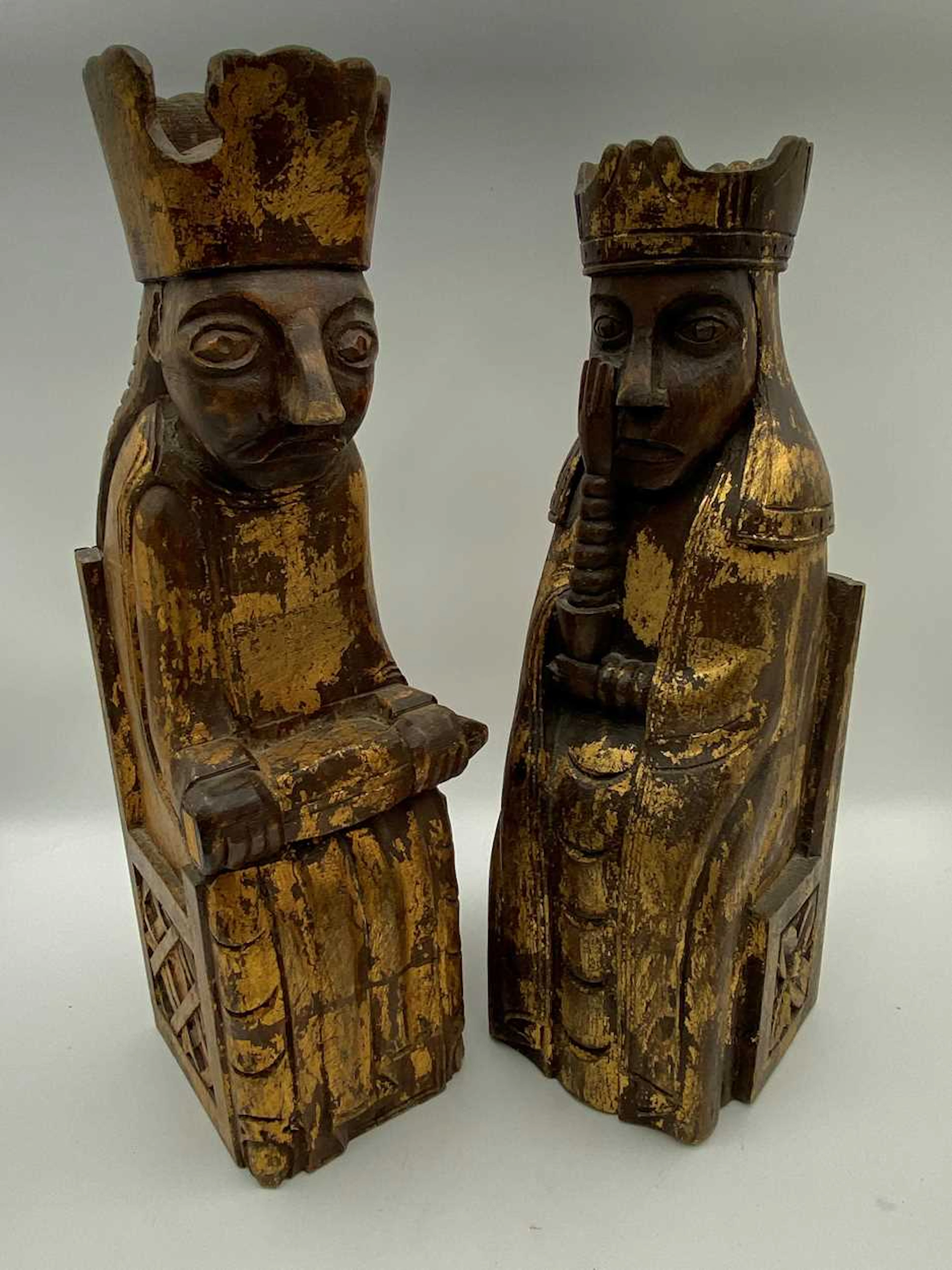 Two carved and gilt seated figures