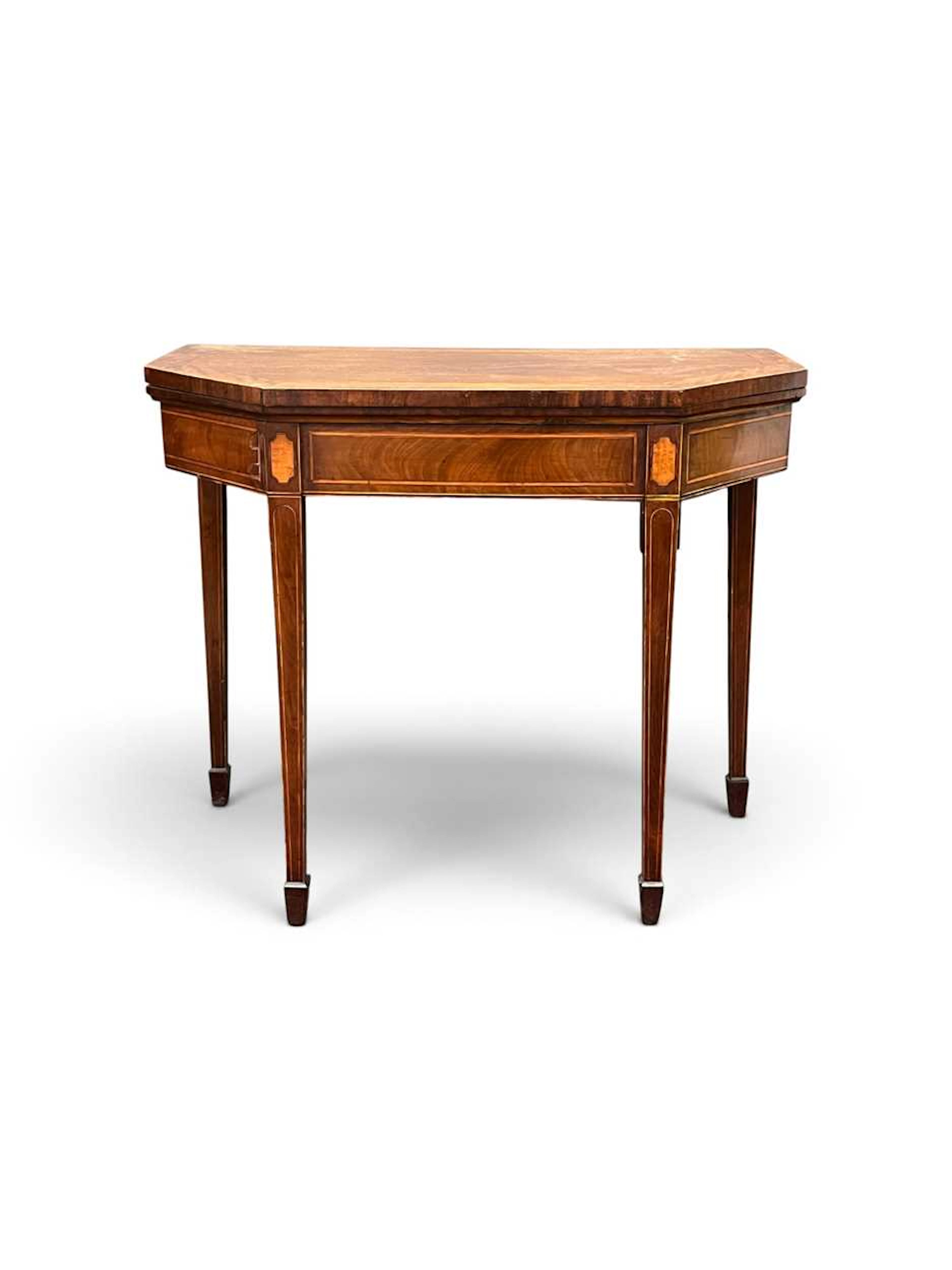 A George III mahogany and satinwood crossbanded card table