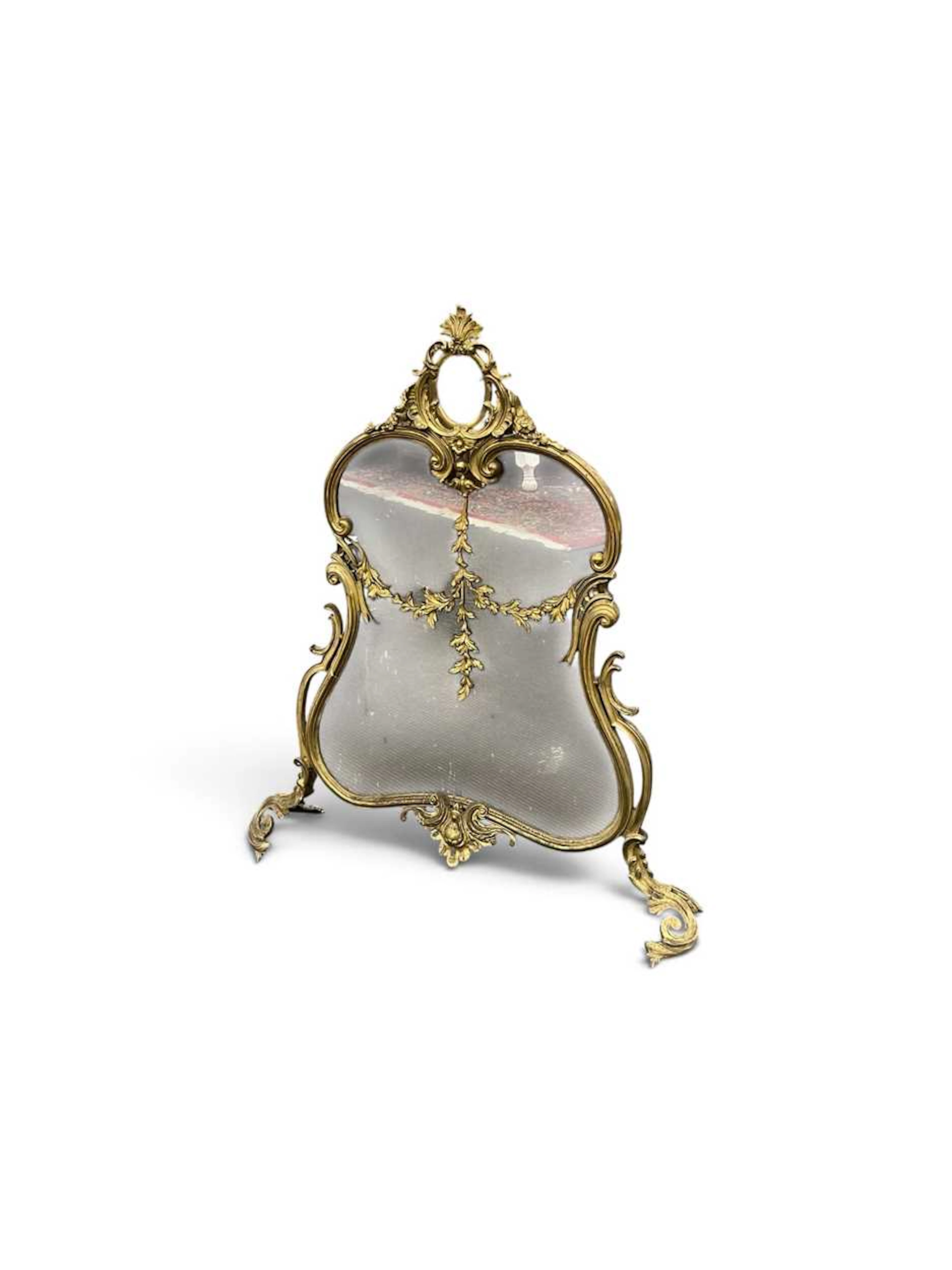 A Rococo style gilt metal spark guard