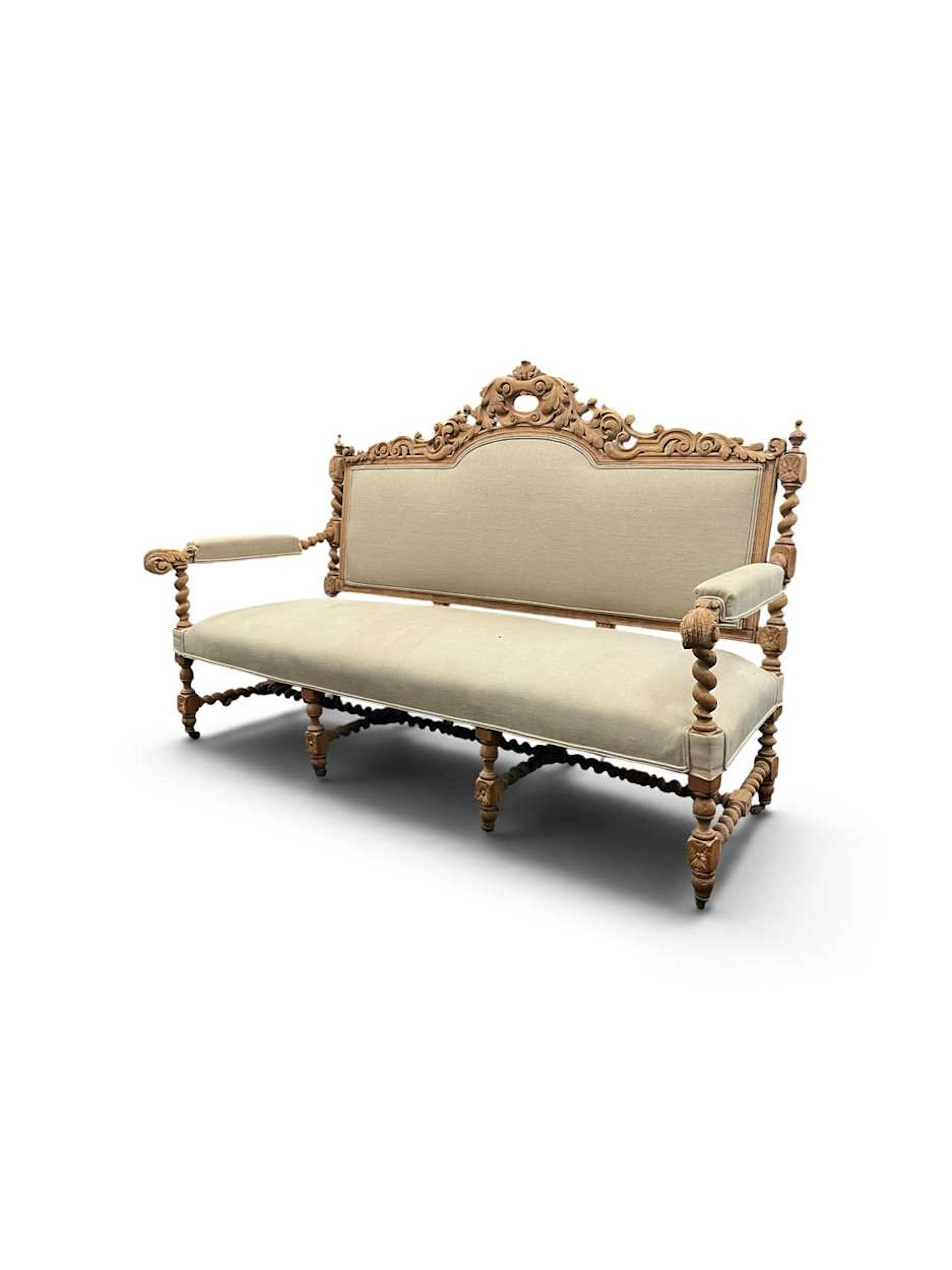 A Baronial style limed wood settee