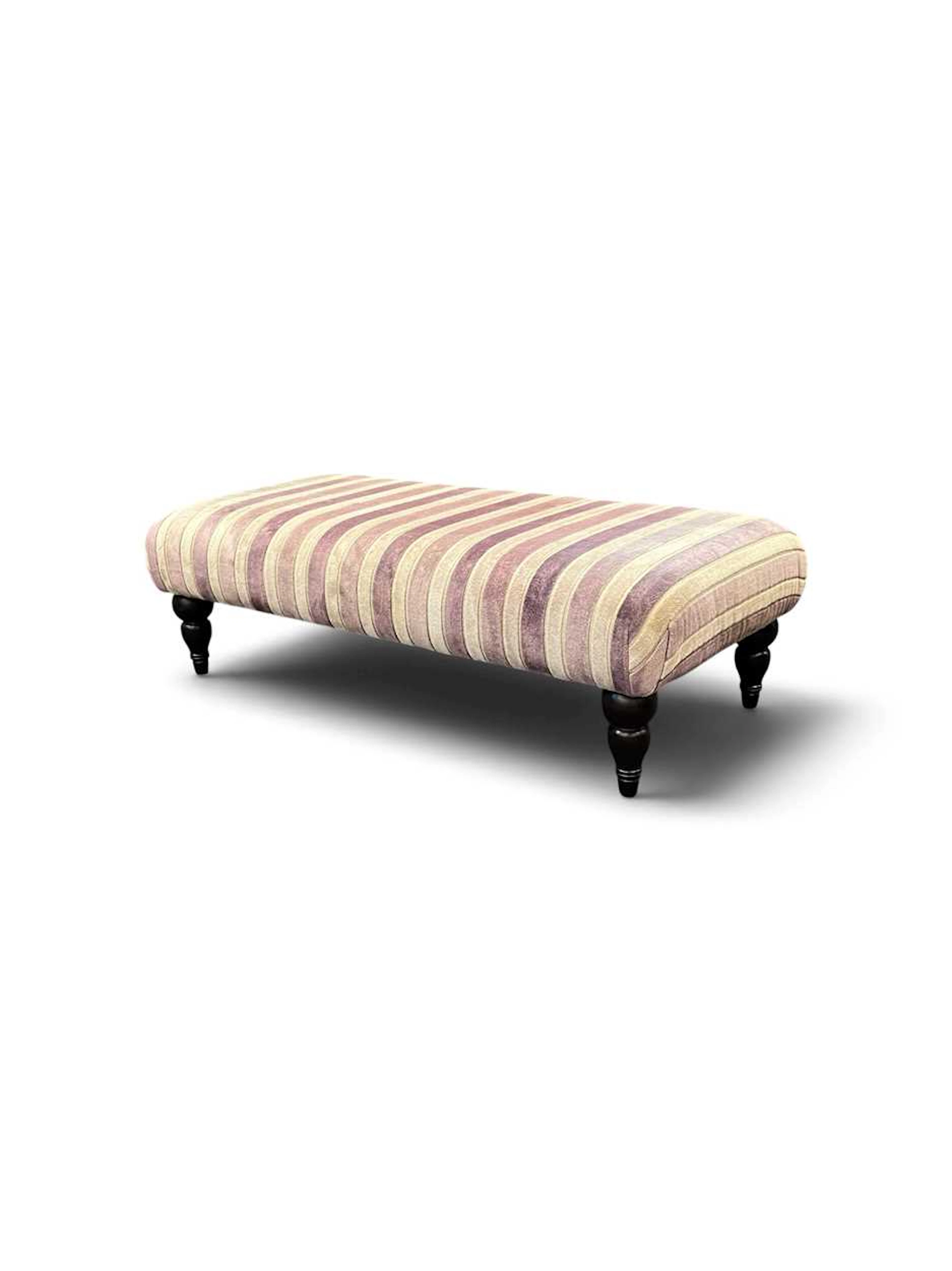 A rectangular footstool (modern) with pink and white cut...