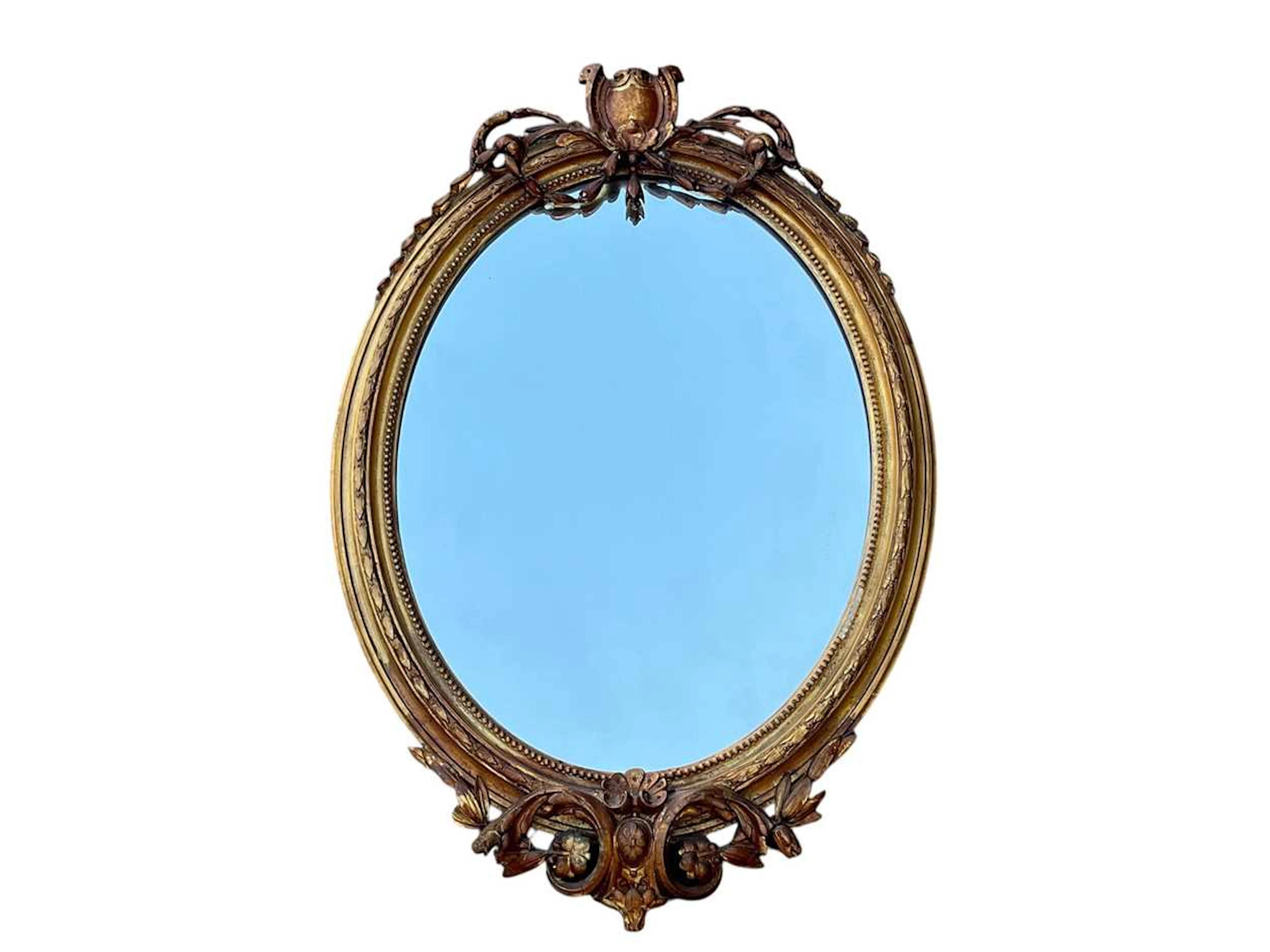 A 19th century oval gilt framed wall mirror (losses) 84 x 56cm