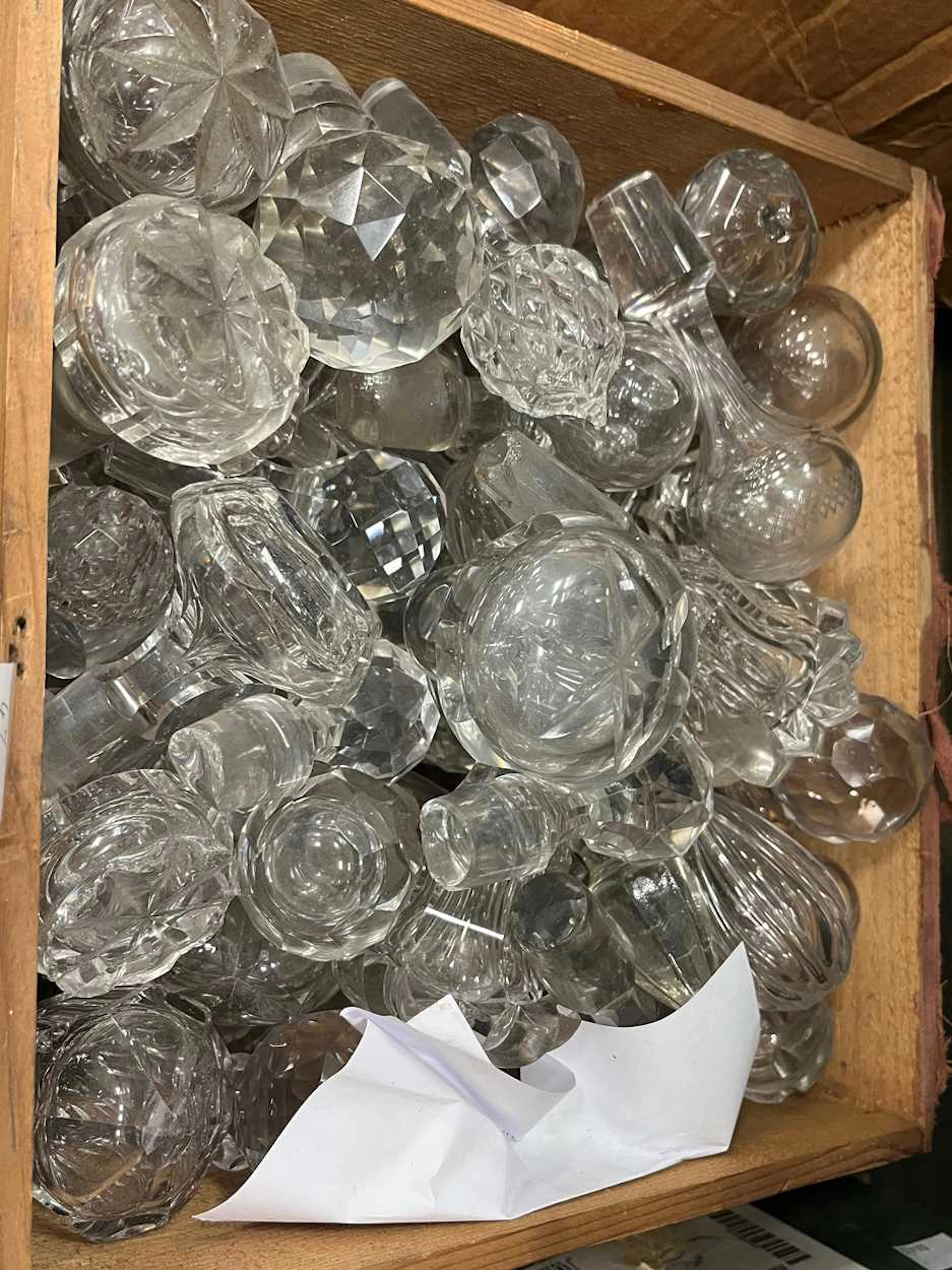 Boxes of glass oddments to include decanter stoppers and...