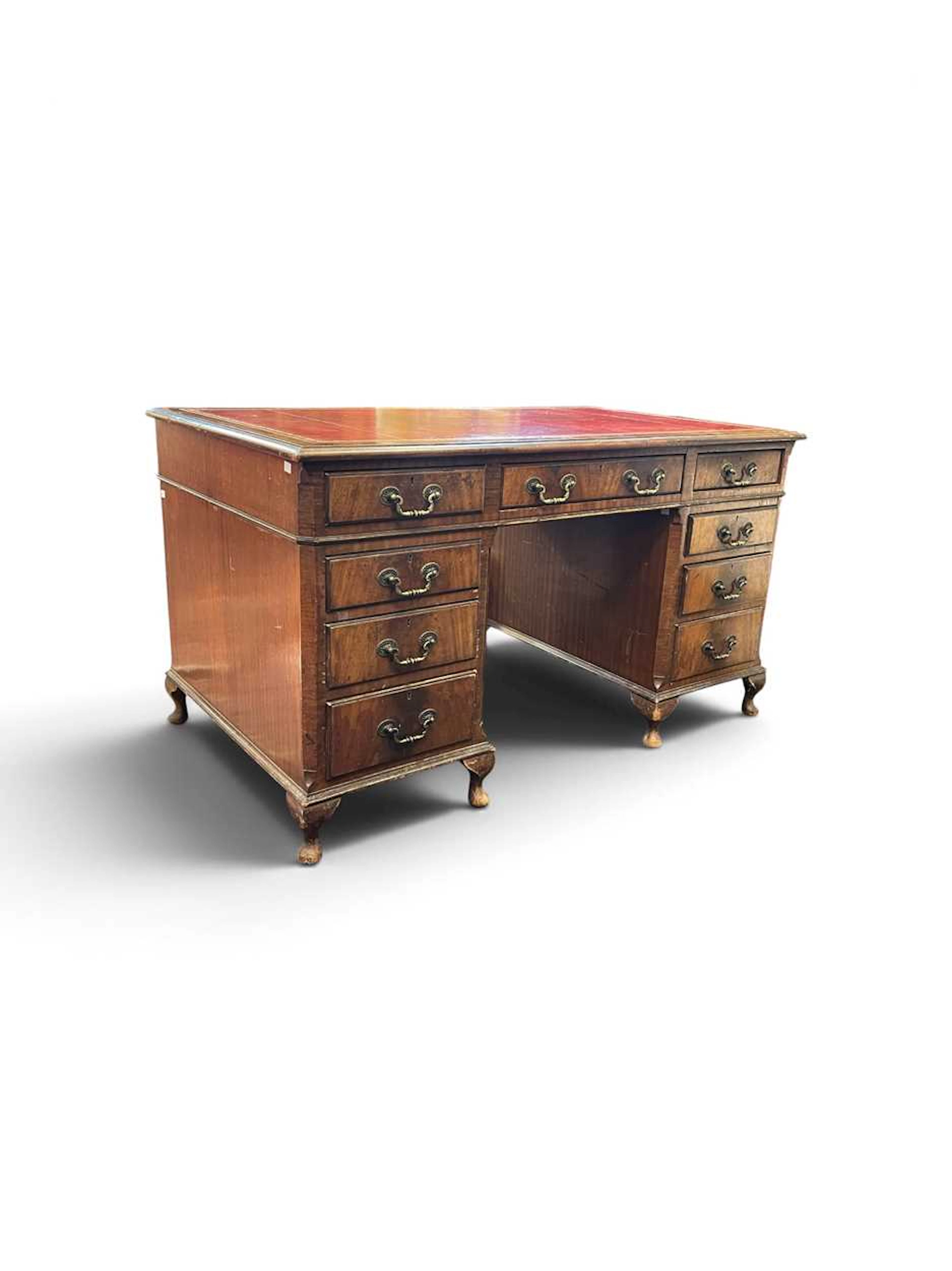 A reproduction mahogany pedestal desk