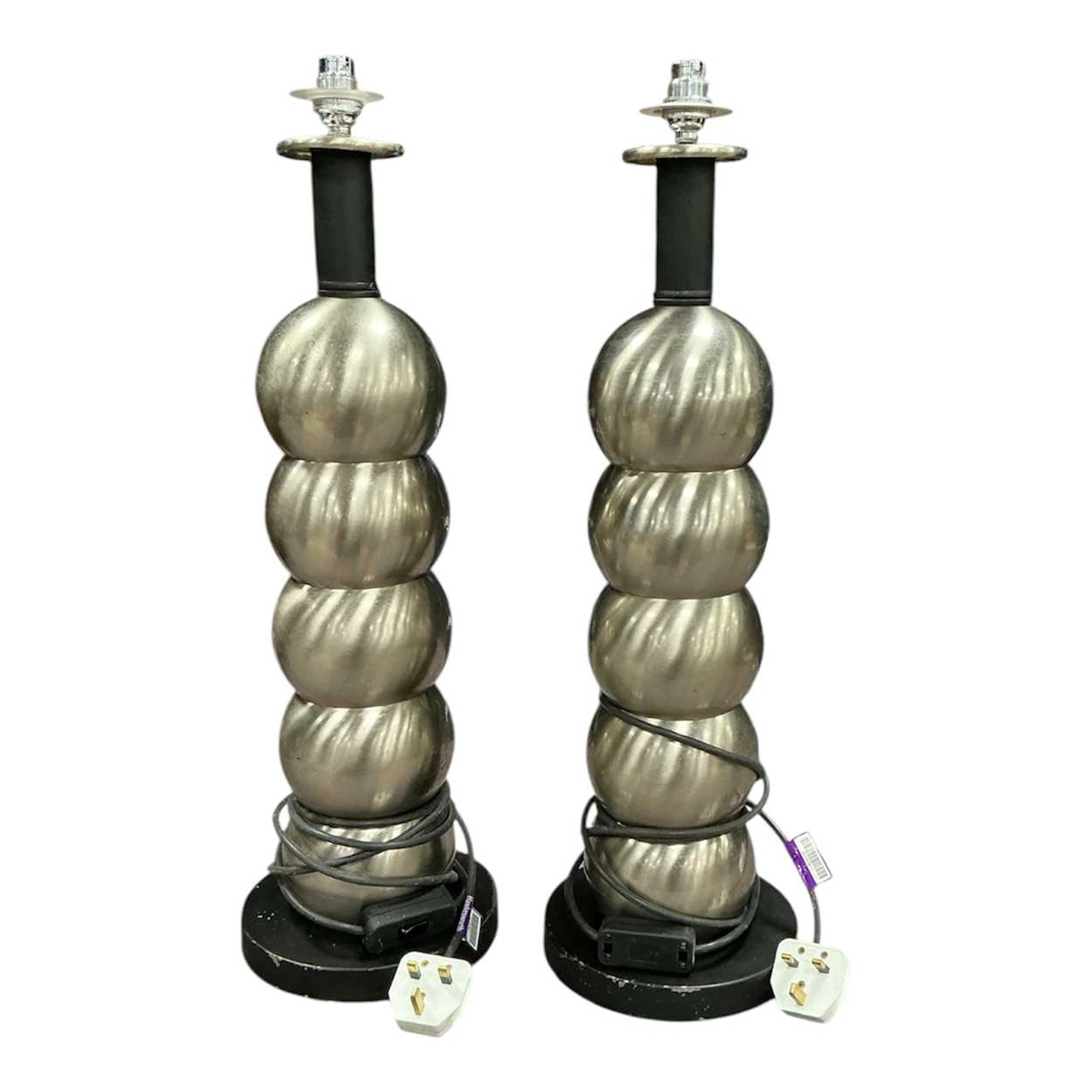 Pair of spun metal bobble lamps on turned black bases