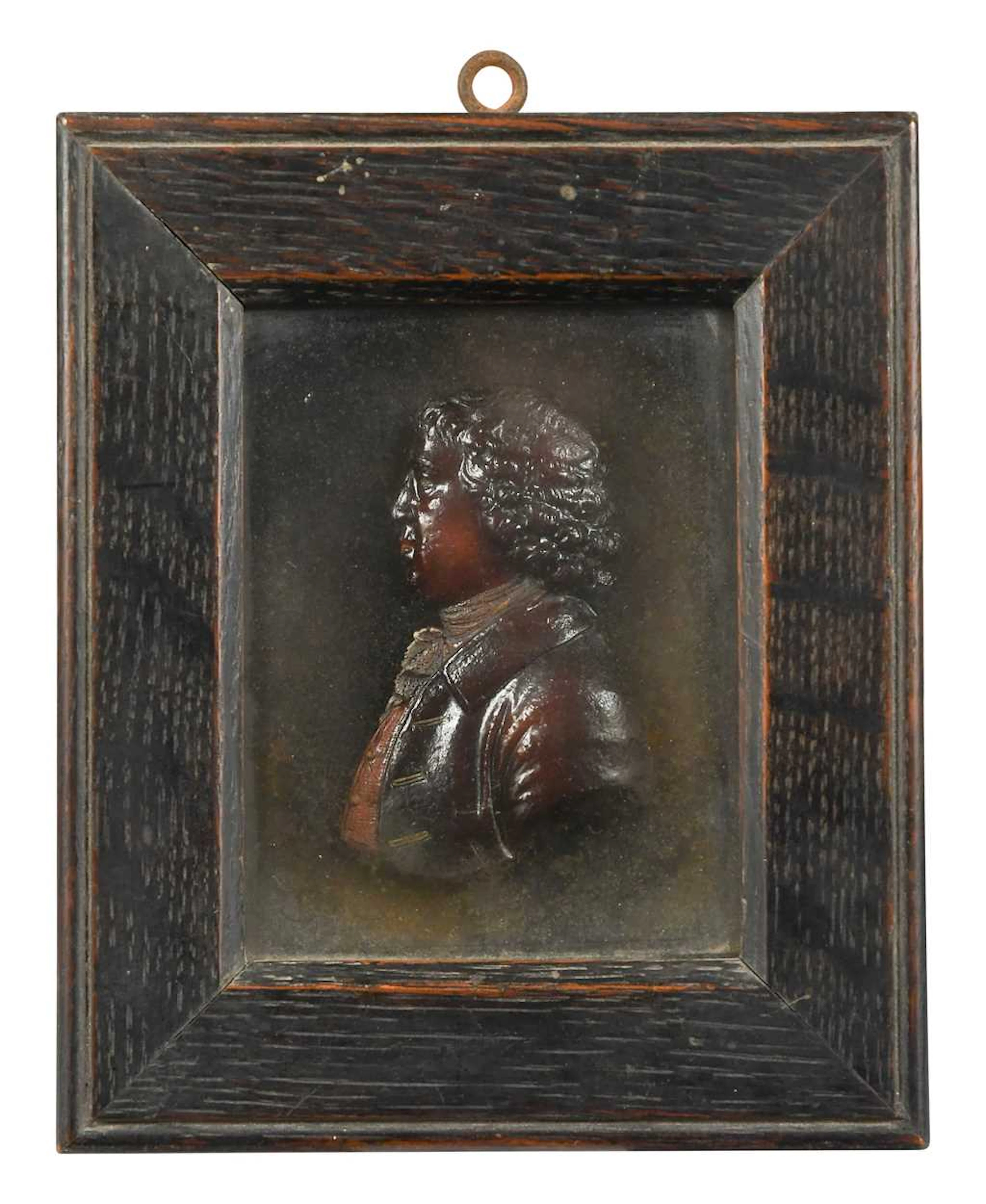 A wax relief profile portrait, 18th century