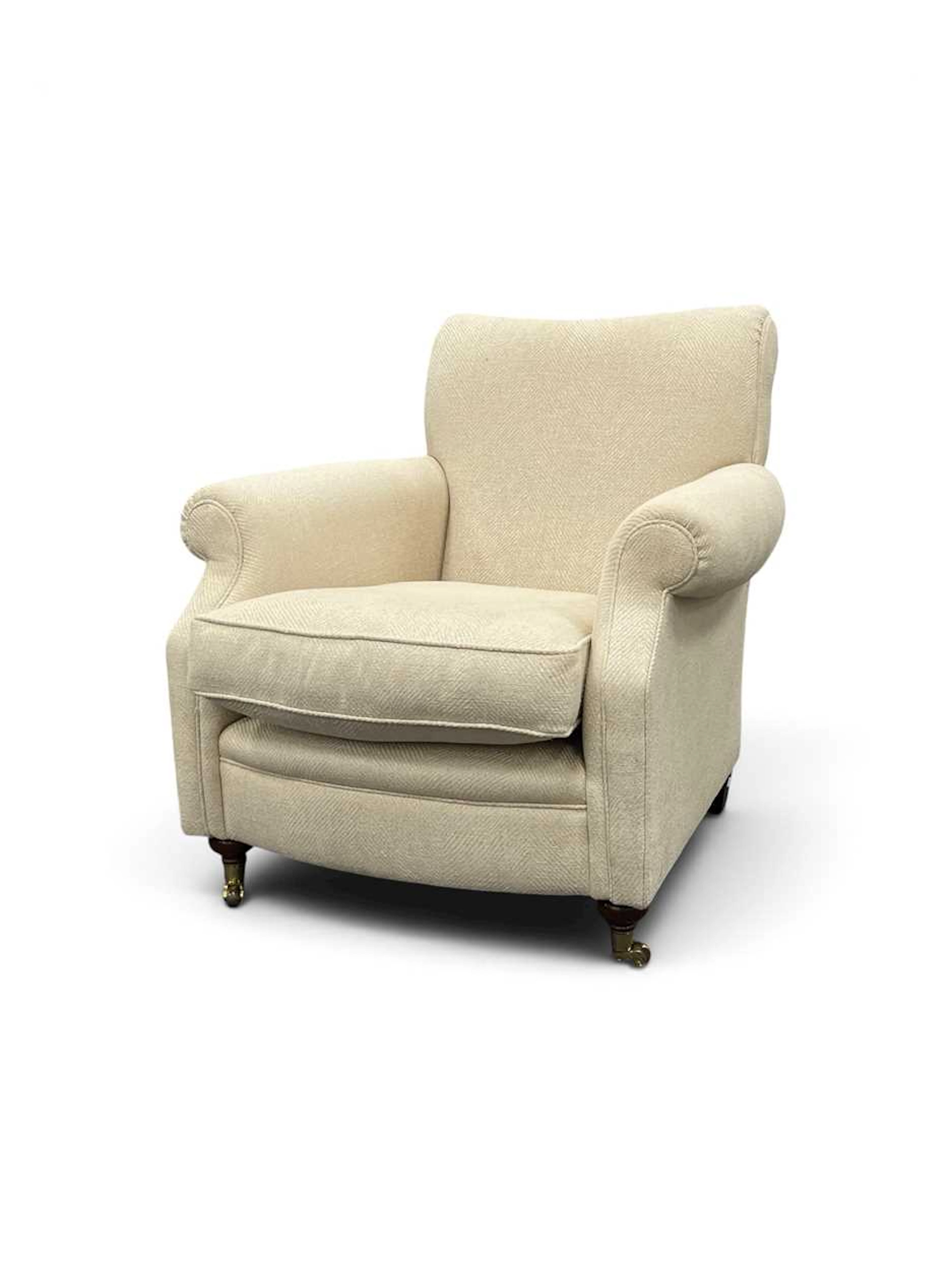 A linen upholstered deep armchair