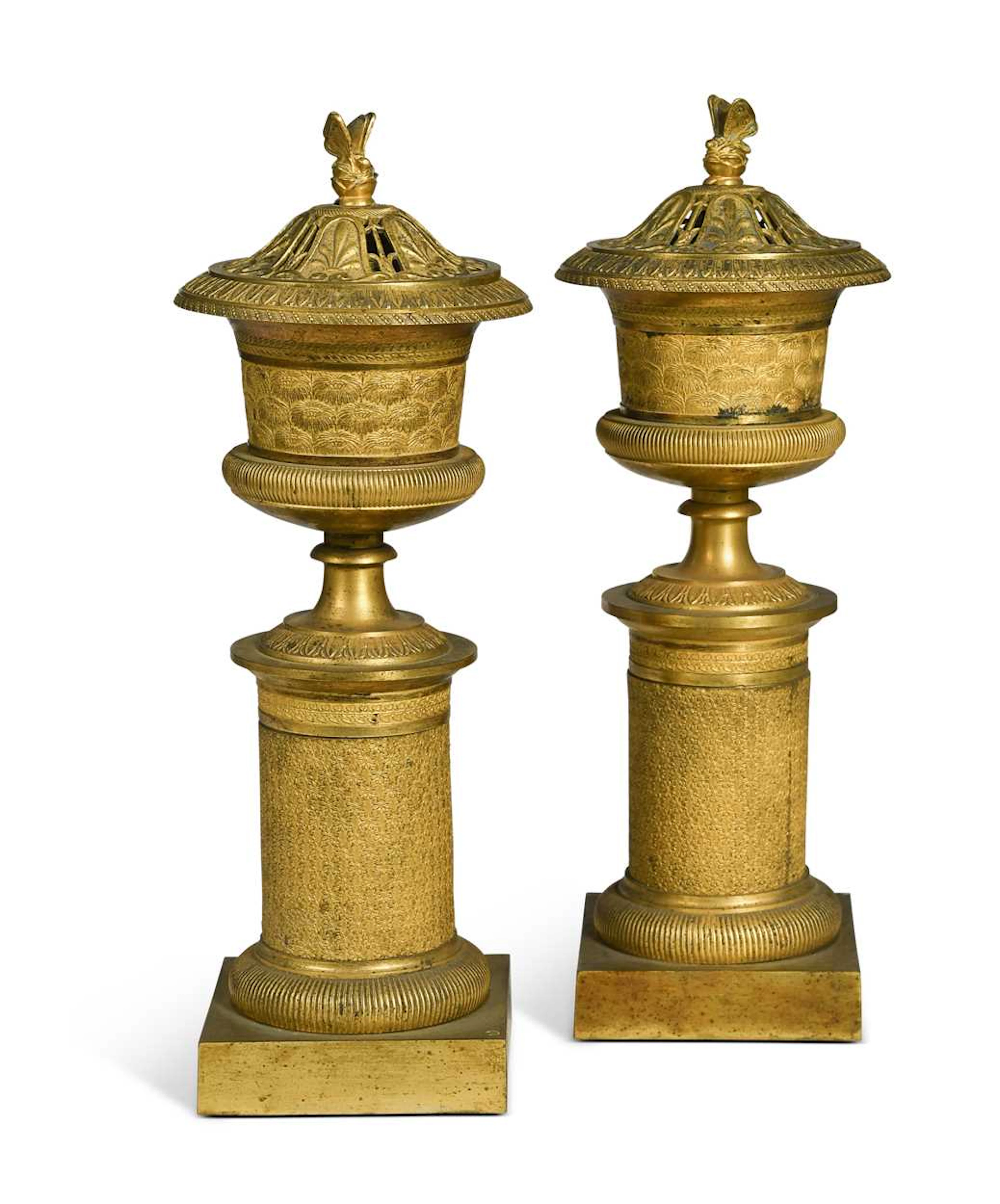 A pair of Neoclassical style ormolu cassolettes or candlesticks, early