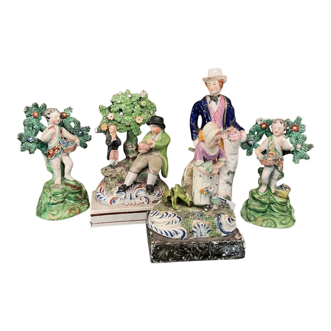 A 19th century figure of a country gentleman wearing a...