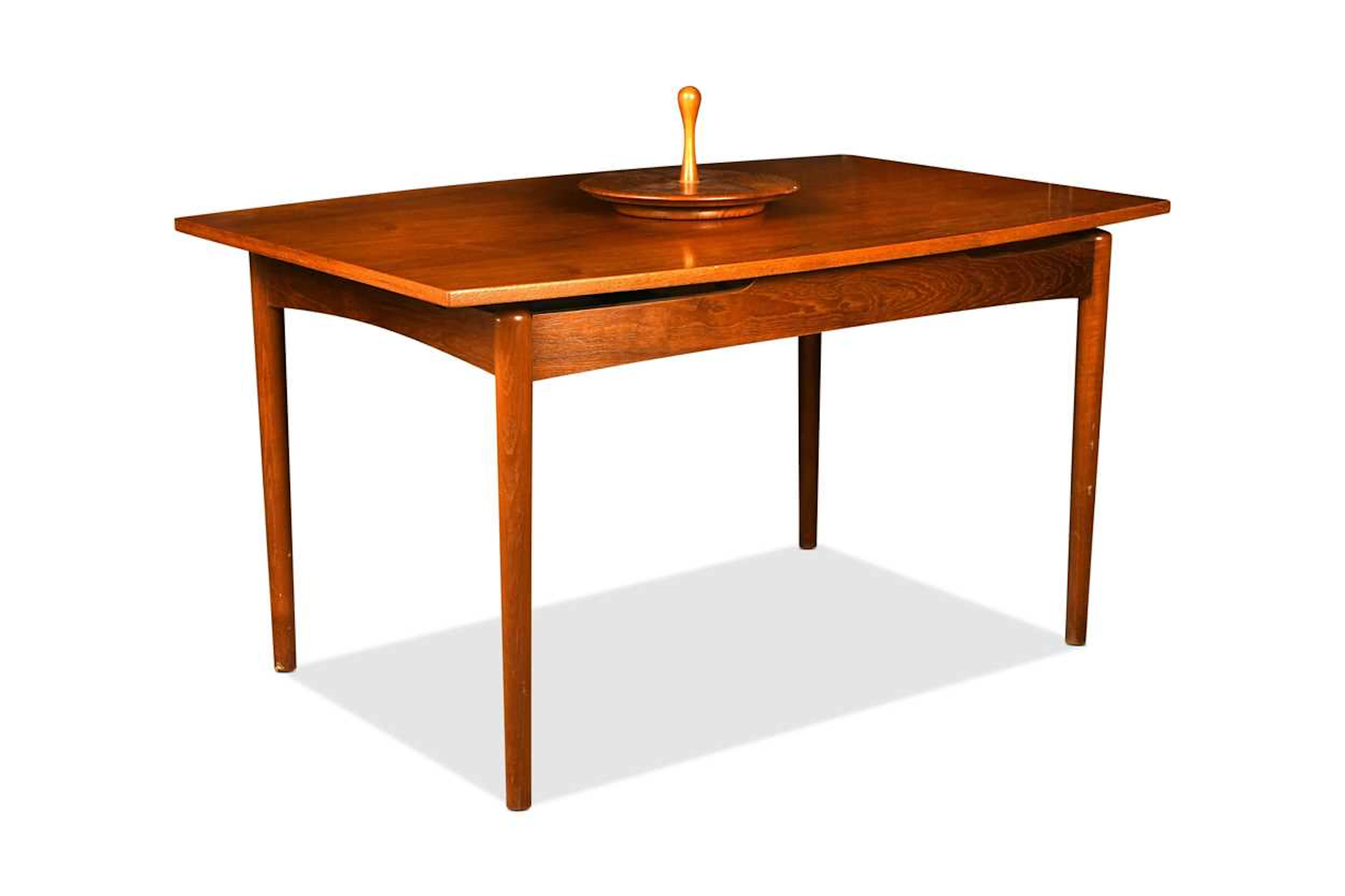 A mid-century Danish teak extending dining table