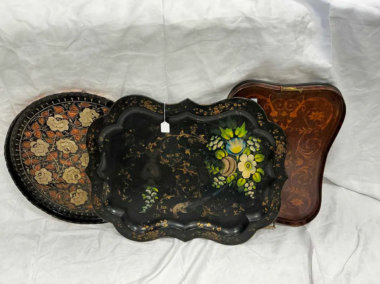 A Victorian tole tray of serpentine form painted with...