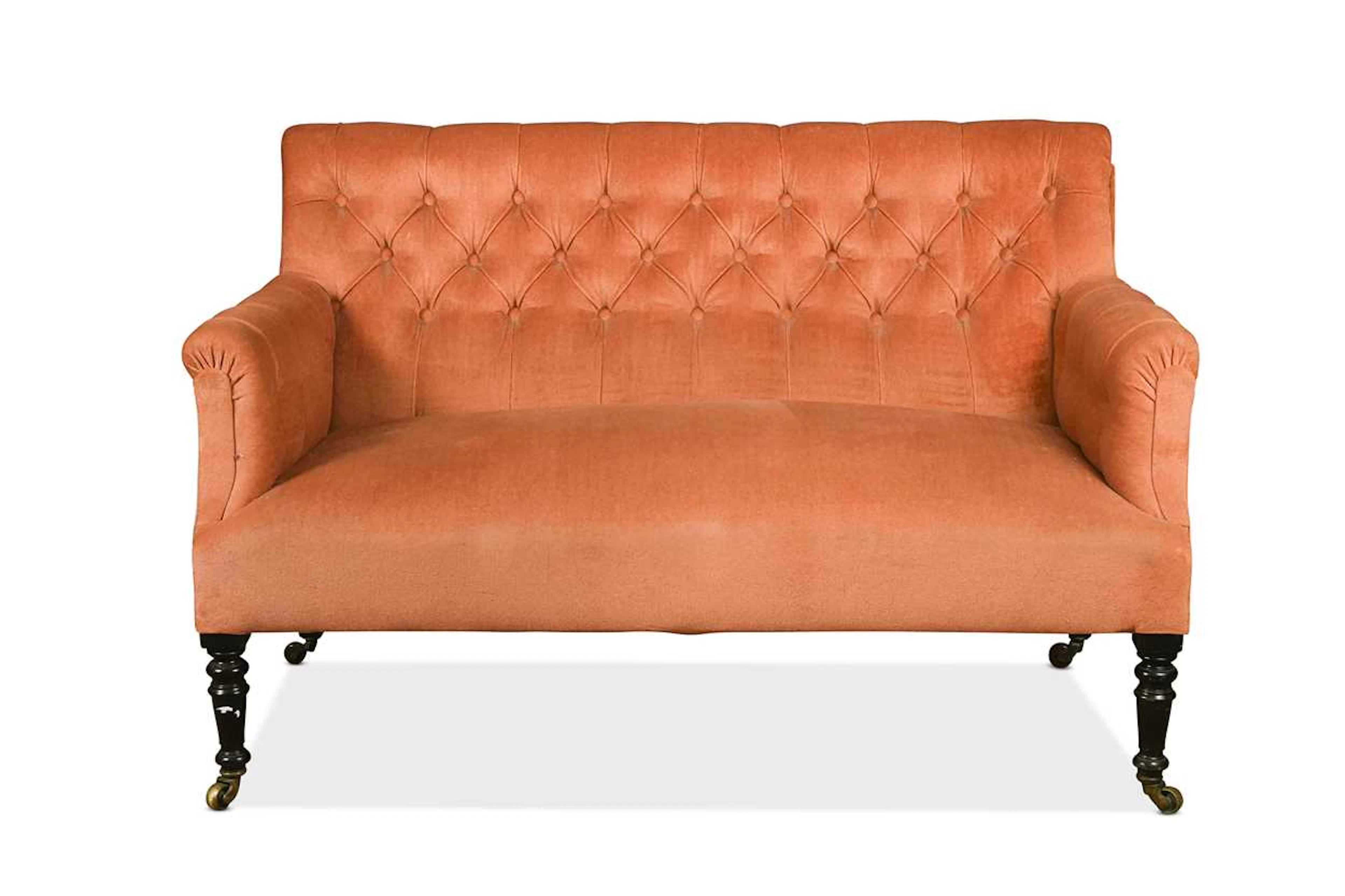 A small Victorian two seat sofa with deep buttoned back