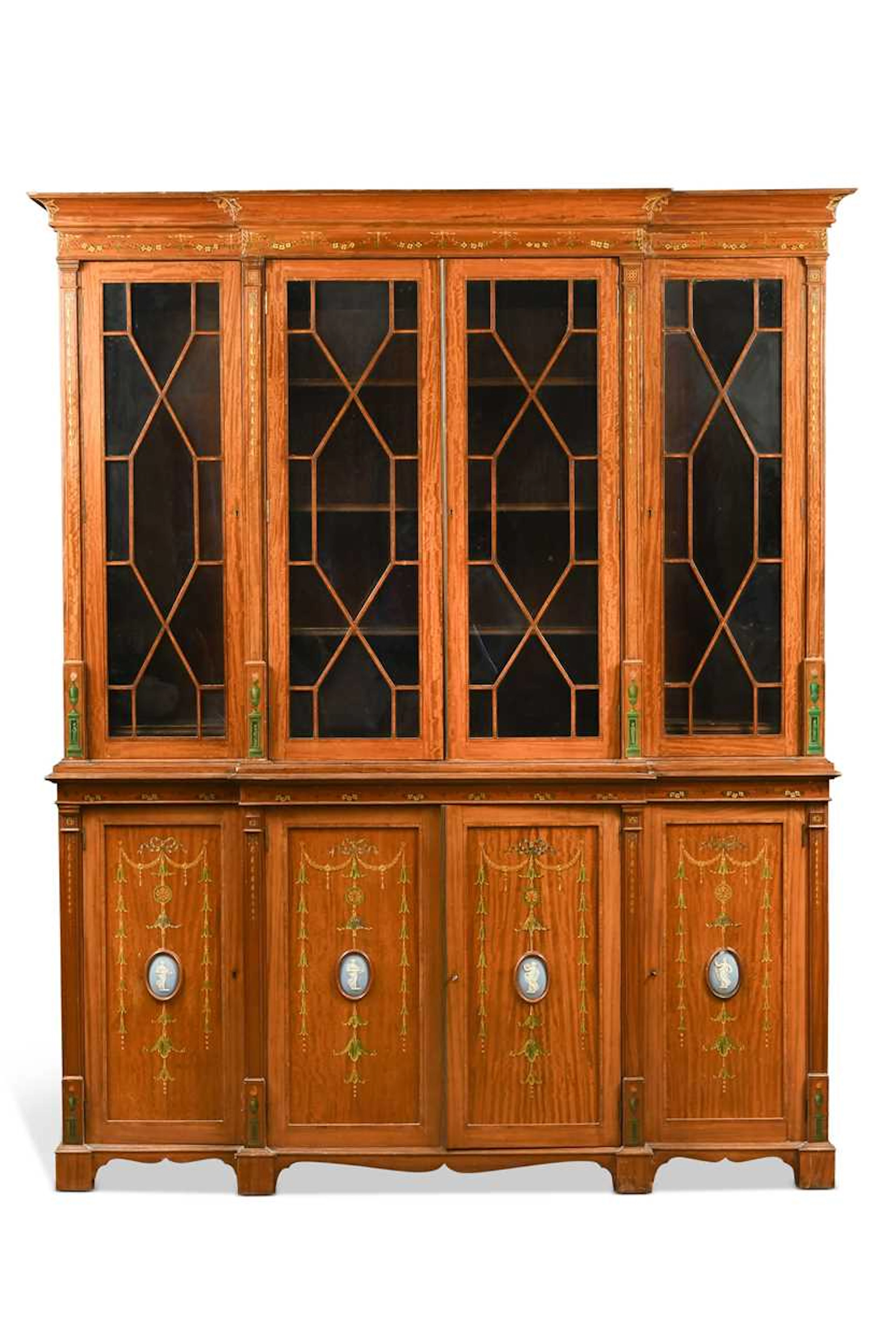 An Edwardian Sheraton revival satinwood breakfront bookcase