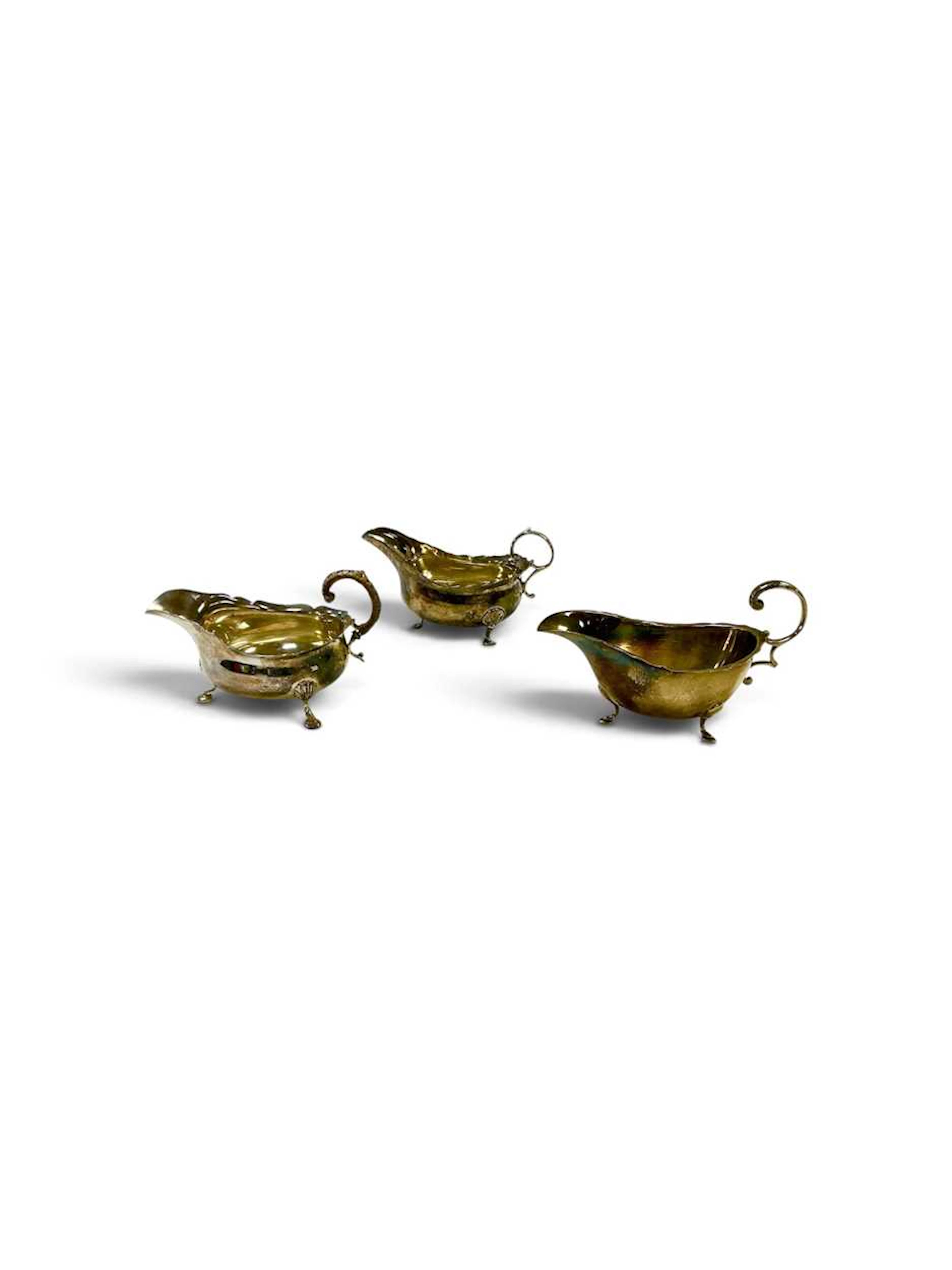 Three silver sauceboats