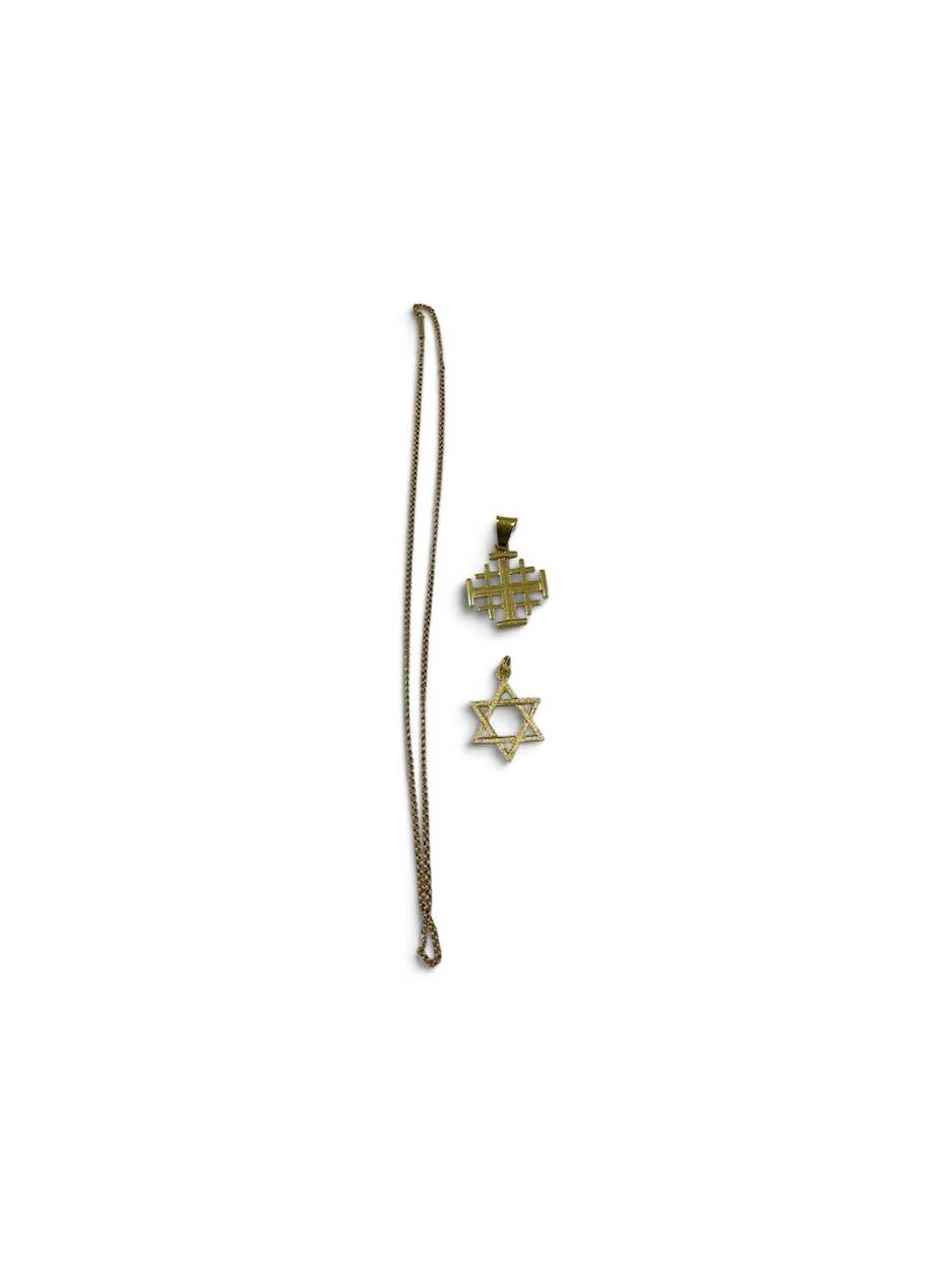 A star of David pendant tested as 18ct gold