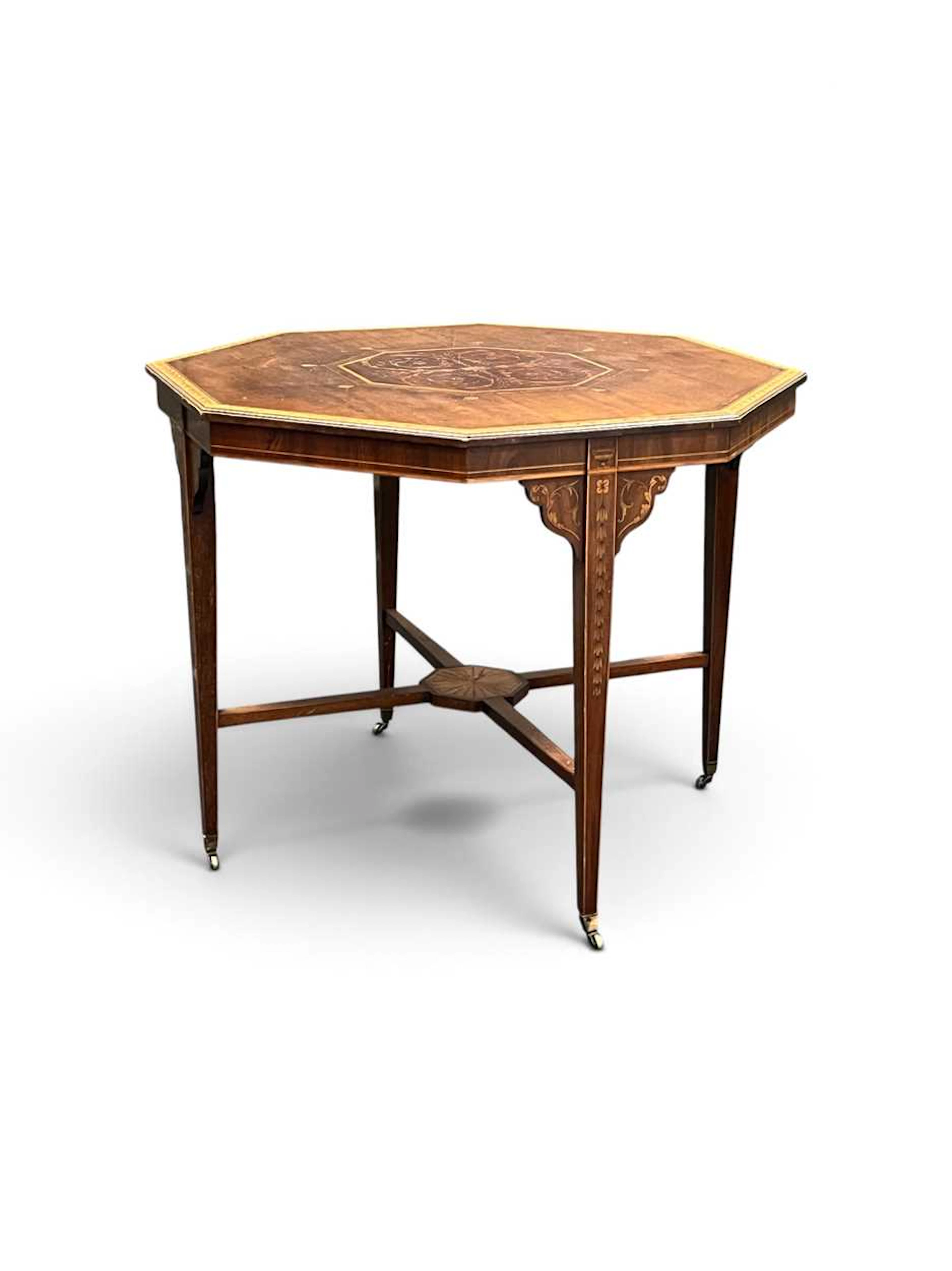An Edwardian marquetry inlaid mahogany centre table