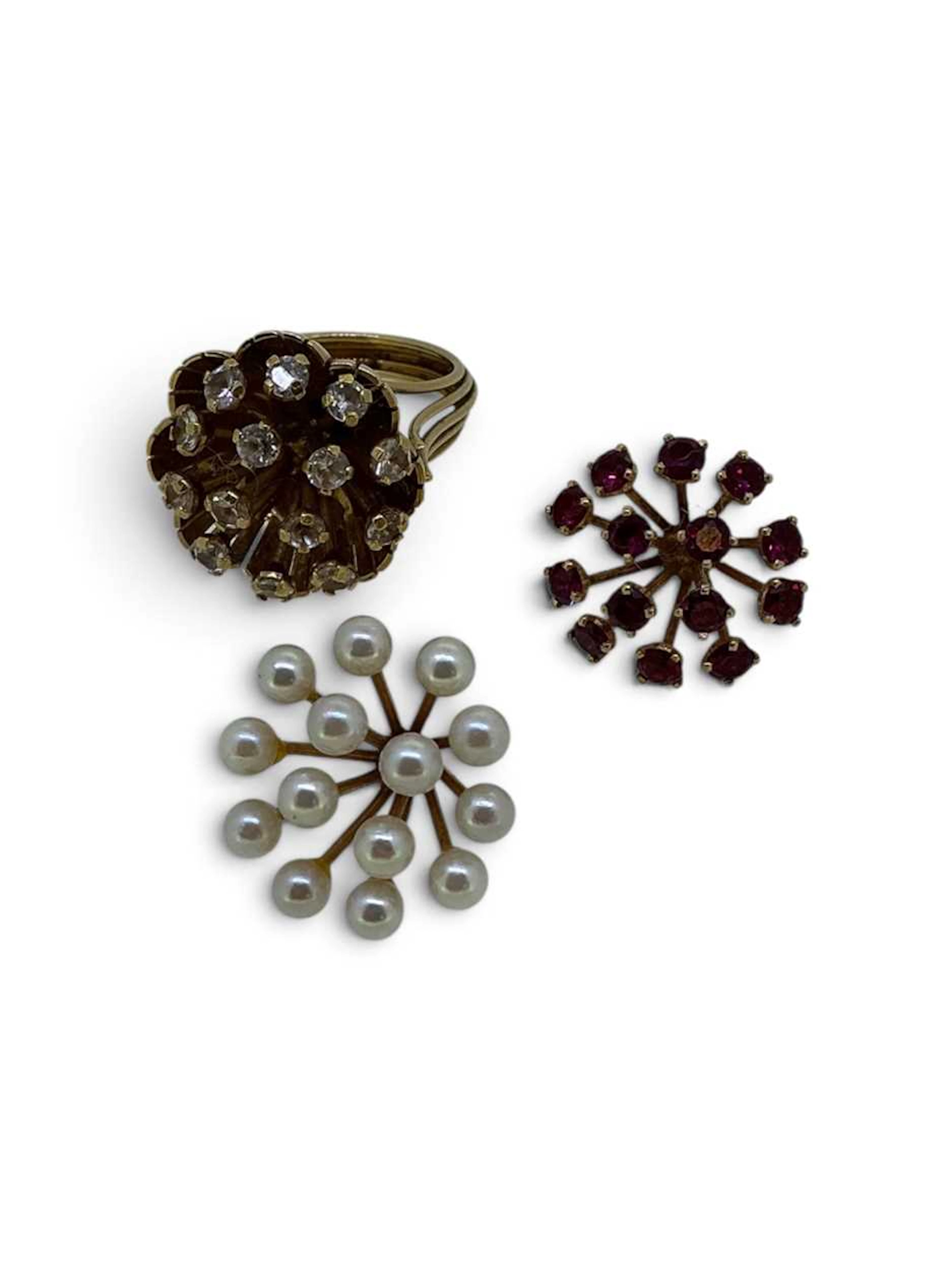 A floral dress ring with detachable heads set with...